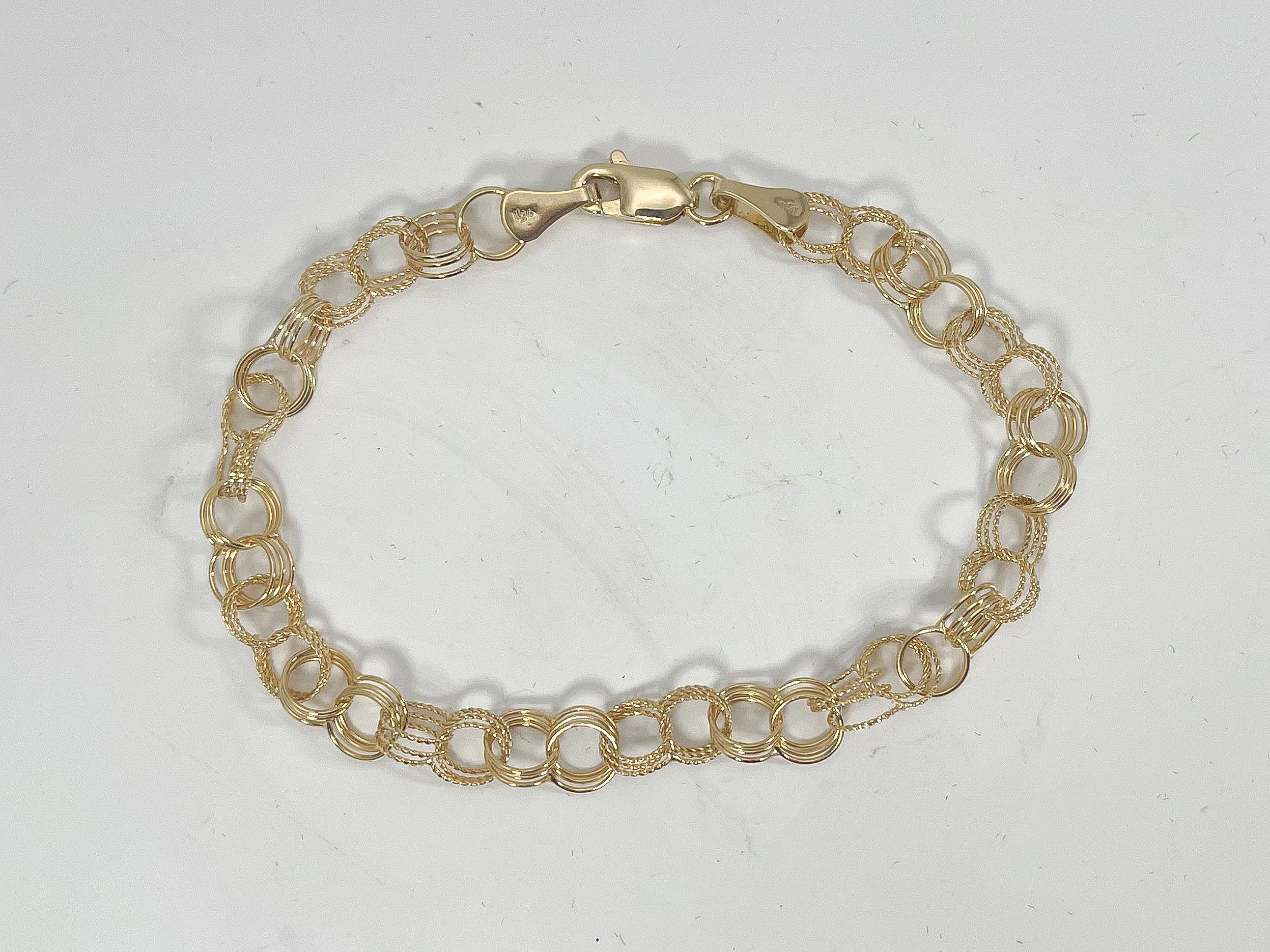 14k yellow gold charm bracelet. The bracelet comes with a lobster clasp, the width measures 5 m, has a length of 7 inches, and a total weight of 3.88 grams.