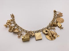 Bracciale con charme in oro giallo 14K e 10K