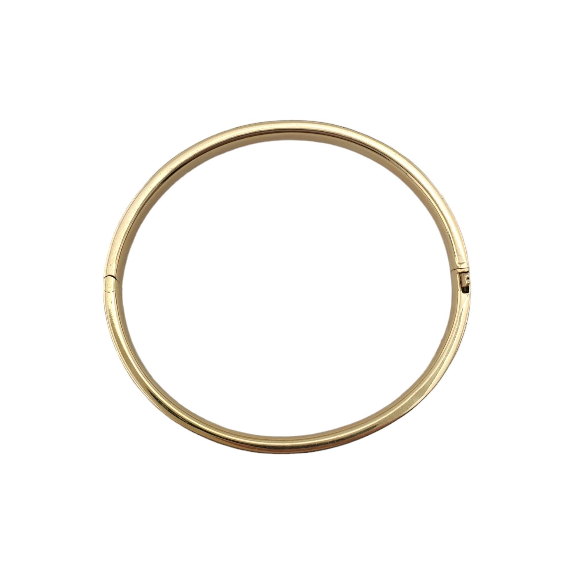14K Yellow Gold Children's Bangle Bracelet - 

This adorable bangle is a sentimental accessory for your child. 

Marked: 14K

Inner circumference of bracelet - 5