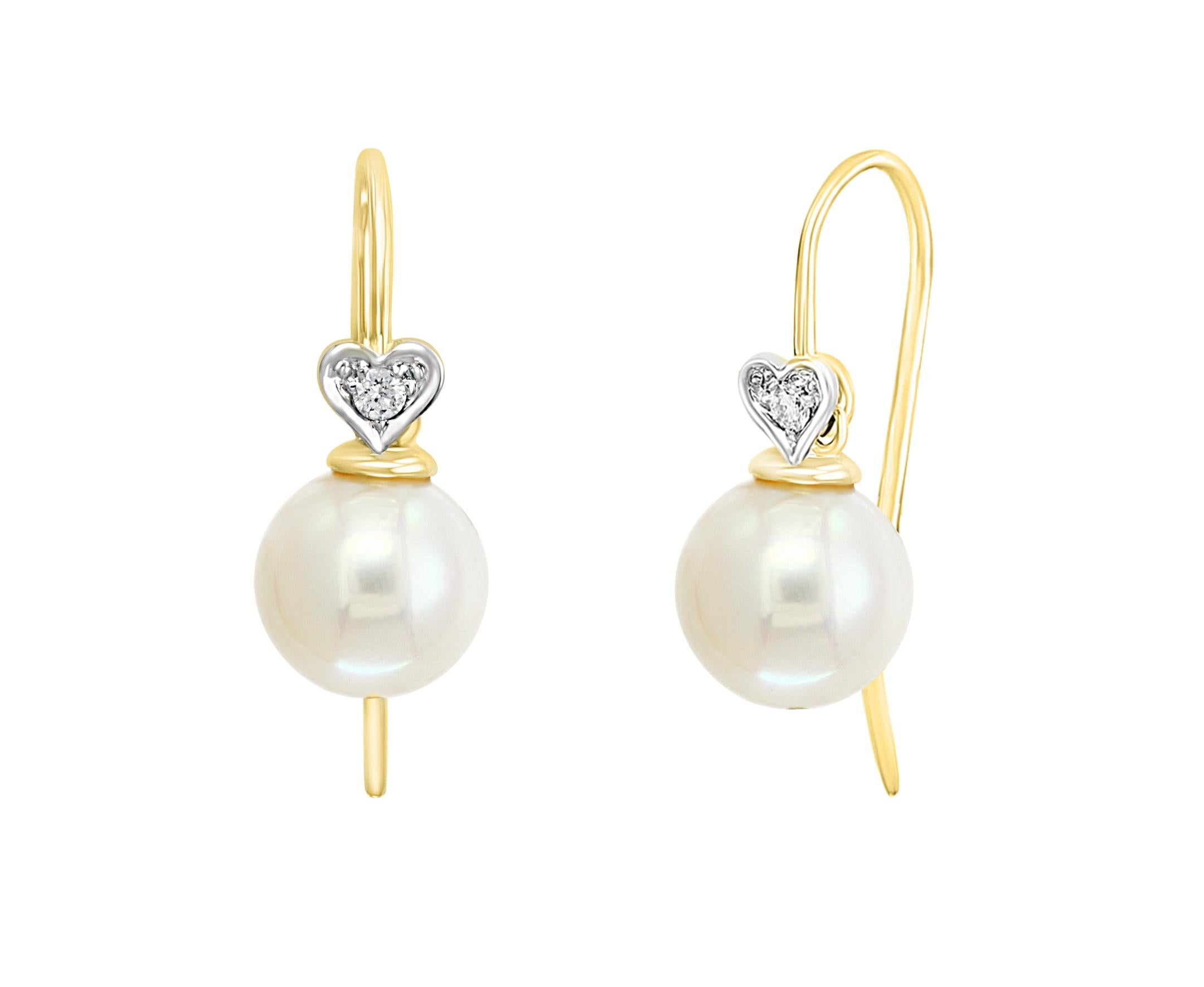 These elegant Diamond and Pearl earrings contain Chinese Freshwater white cultured round pearls measuring 8-8.5mm set on 14K yellow gold and diamond hearts with 0.06 carats of diamonds. Simple, yet elegant, these earrings are a great addition to any