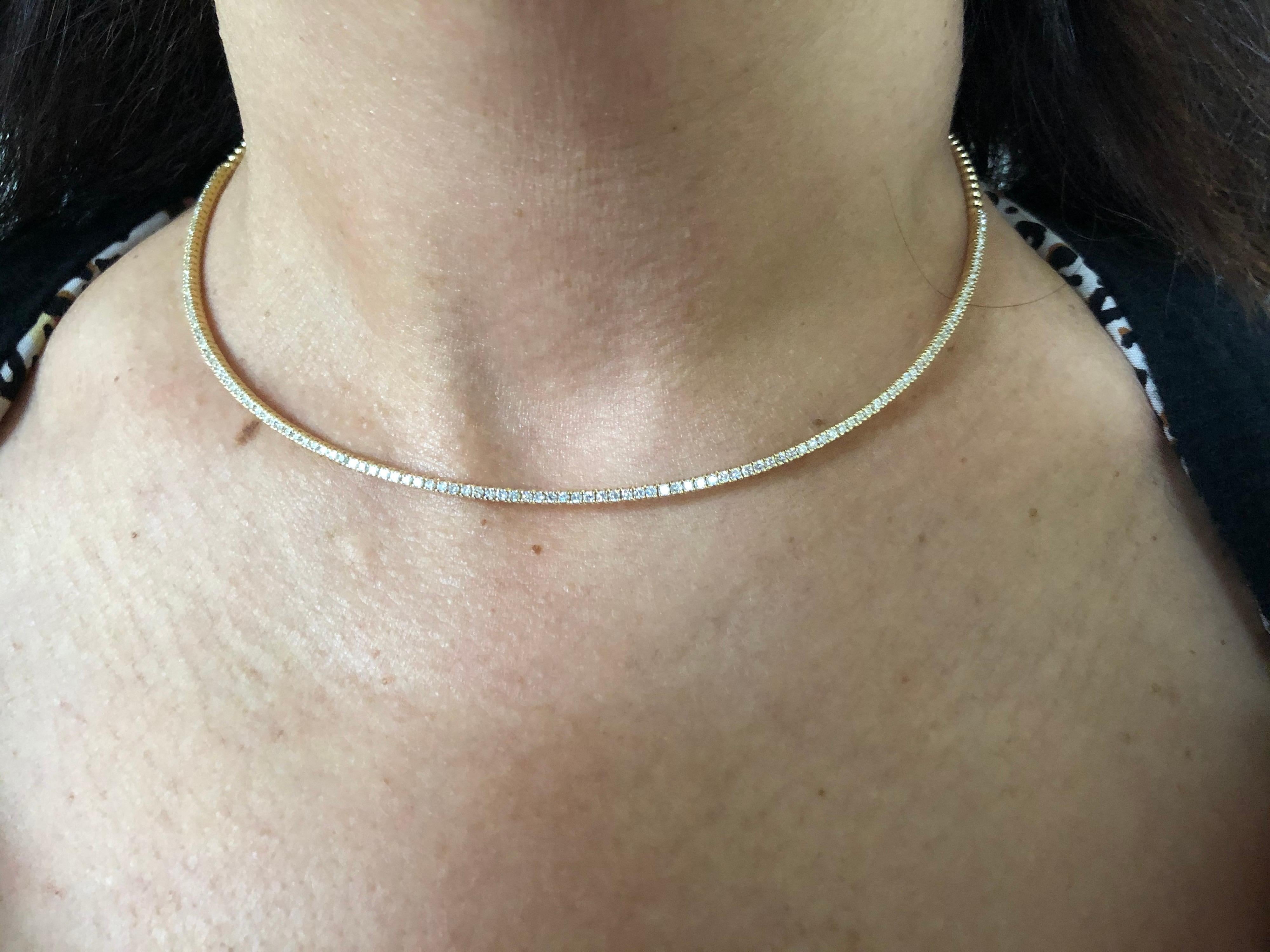 Choker necklace set in 18K yellow gold. The choker necklace is a rigid style and the diamonds are set half-way. The total carat weight of the necklace is 1.86 carats. The stones are G, the clarity is SI1-SI2. The necklace is available in white and