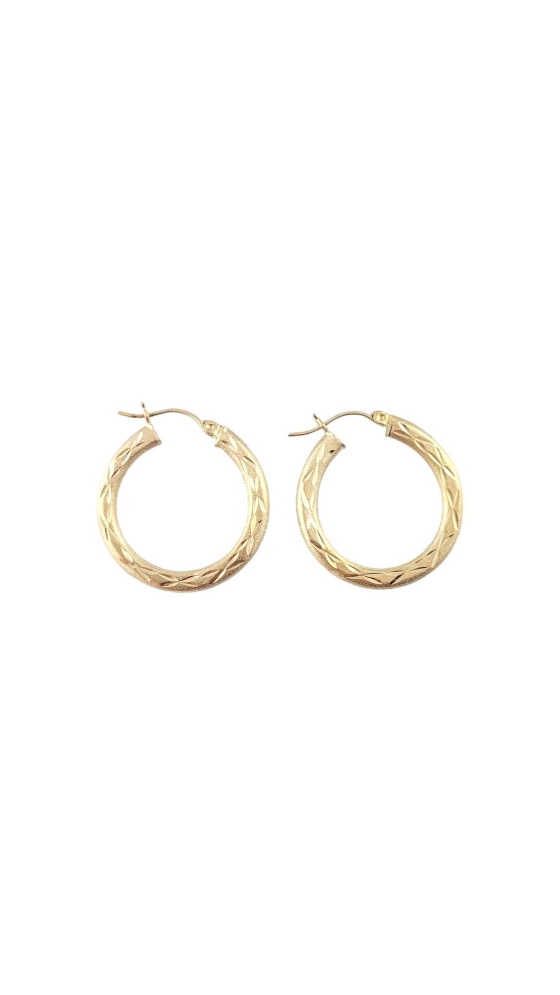 14 Karat Yellow Gold Hoop Earrings-

These gorgeous gold hoops feature unique engravings and are a perfect addition to your collection. 

Size: 29.1 mm x 2.4 mm x 3.6 mm. 

Stamped: 14K

Weight: 1.3 dwt./ 2.1 gr.

Very good condition, professionally