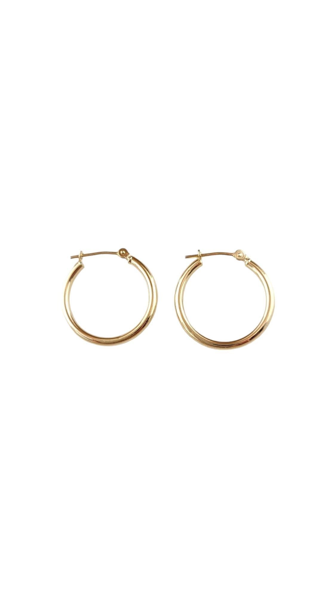 Vintage 14 Karat Yellow Gold Hoop Earrings-

These classic gold hoops are a timeless addition to your collection. 

Size: 20.2 mm x 2.1 mm x 2.3 mm. 

Stamped: PC 14K Israel 

Weight: 0.5 dwt./ 0.9 gr.

Very good condition, professionally