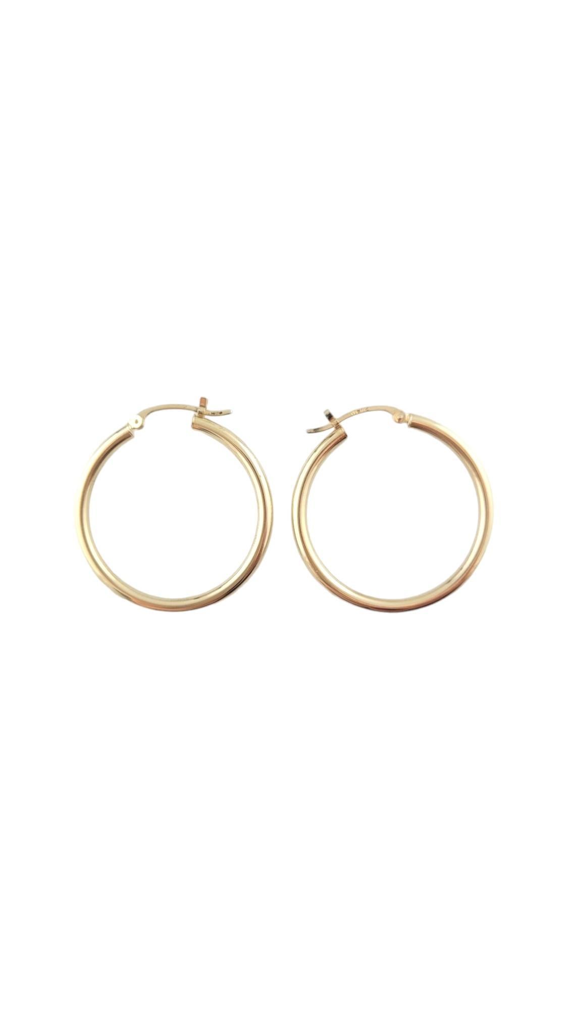 14 Karat Yellow Gold Hoop Earrings-

These classic gold hoops are a timeless addition to your collection. 

Size: 29.8 mm x 2.3 mm x 2.4 mm. 

Stamped: 14K

Weight: 1.0 dwt./ 1.6 gr.

Very good condition, professionally polished.

Will come packaged