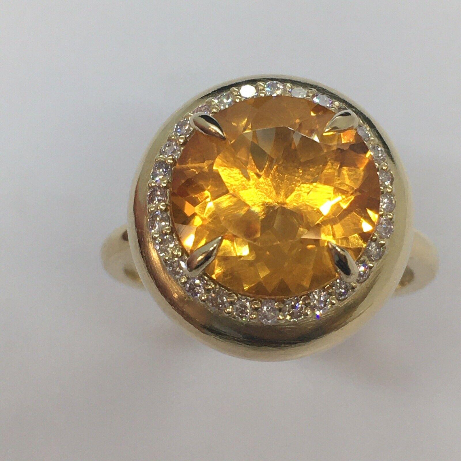 14K Yellow Gold Citrine 1/4 Carat Total Weight Red Diamond Bombe’ Ring Size 10

12mm round citrine 5.5 Carat weight 
28 pieces of 1.3 mm round natural Rose Color Diamond 1/4 Carat total diamond weight
8.4 gram
Size 10
3/4 inch in diameter on