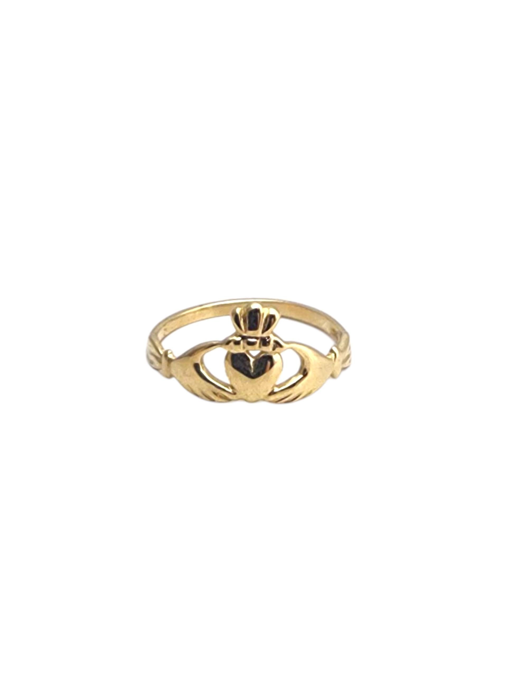 14K Yellow Gold Claddagh Baby Ring -

A timeless symbol of love and loyalty, this 14K yellow gold Claddagh ring features the traditional heart, hands, and crown design, blending rich Irish heritage with elegant craftsmanship.

Weight: 0.7 gr. / 0.5