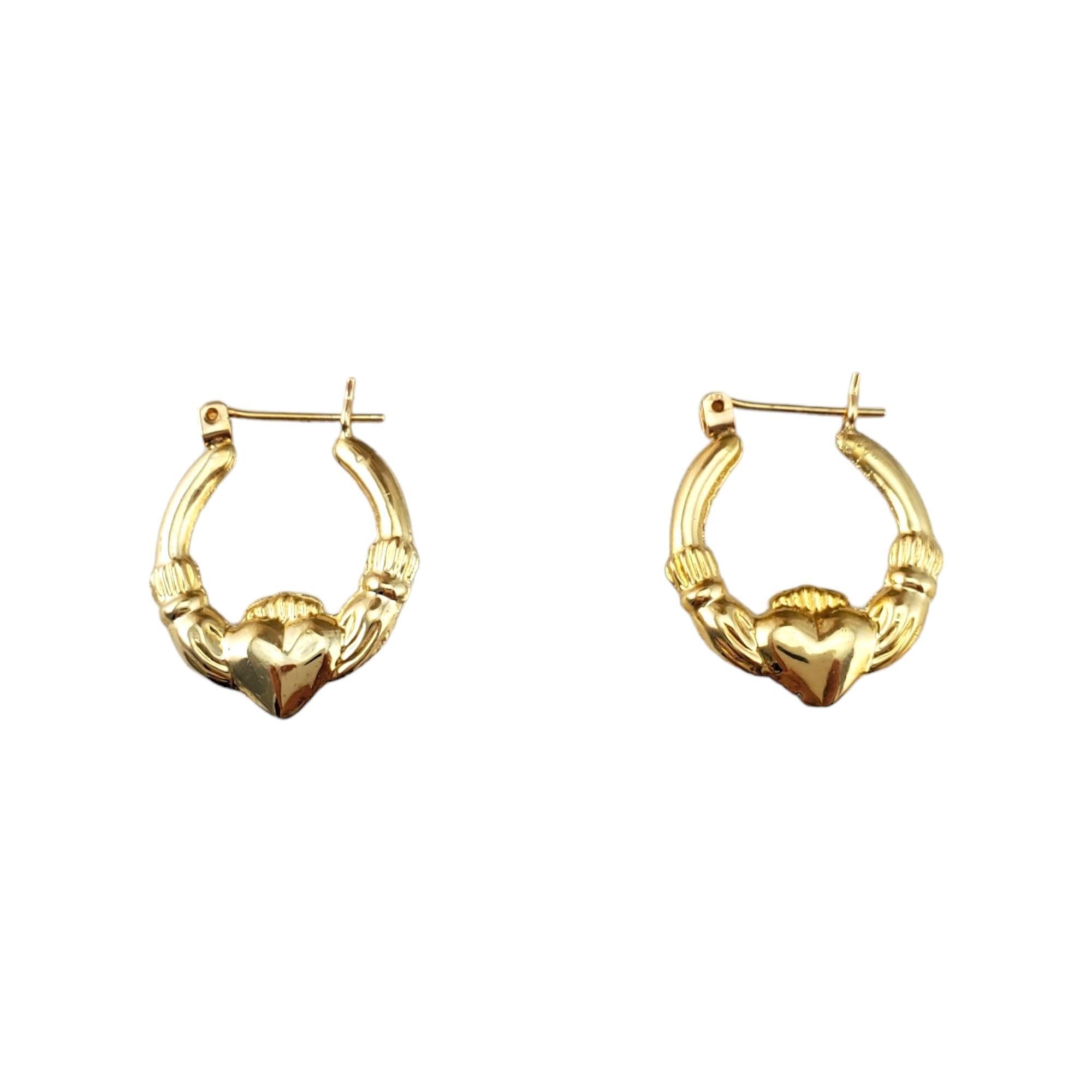 14K Yellow Gold Claddagh Hoops 

Crafted from genuine 14K yellow gold, these hoops feature the iconic Claddagh design: a heart held by hands with a crown atop, symbolizing love, loyalty, and friendship.

Hallmark: 14

Weight: 1.5 g/ 1.0 dwt.

Size: