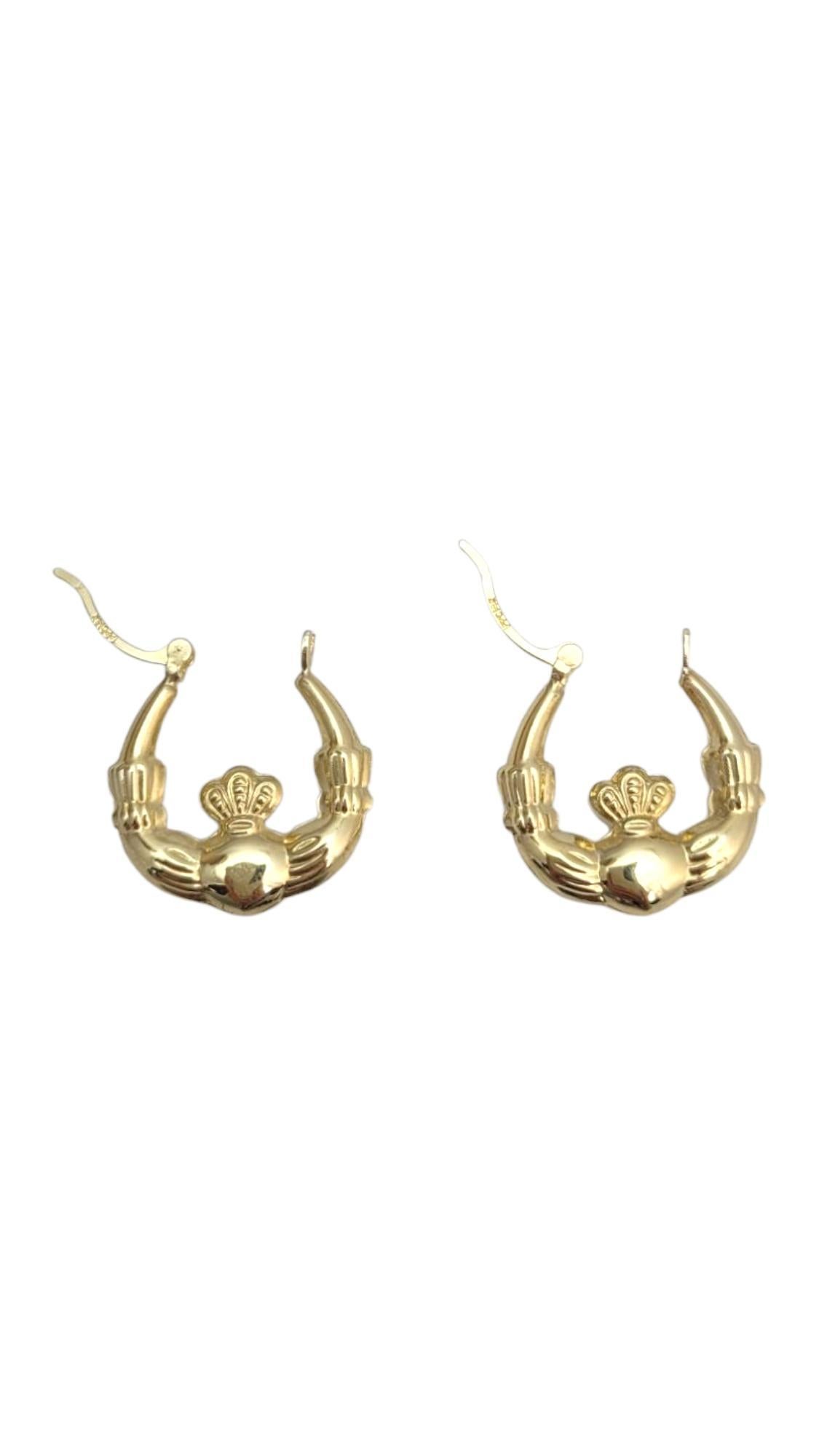 14K Yellow Gold Claddagh Hoop Earrings -

These 14k yellow gold Claddagh earrings beautifully capture the symbol of love, loyalty, and friendship. Featuring the iconic heart, hands, and crown design, they offer a meaningful and timeless accessory