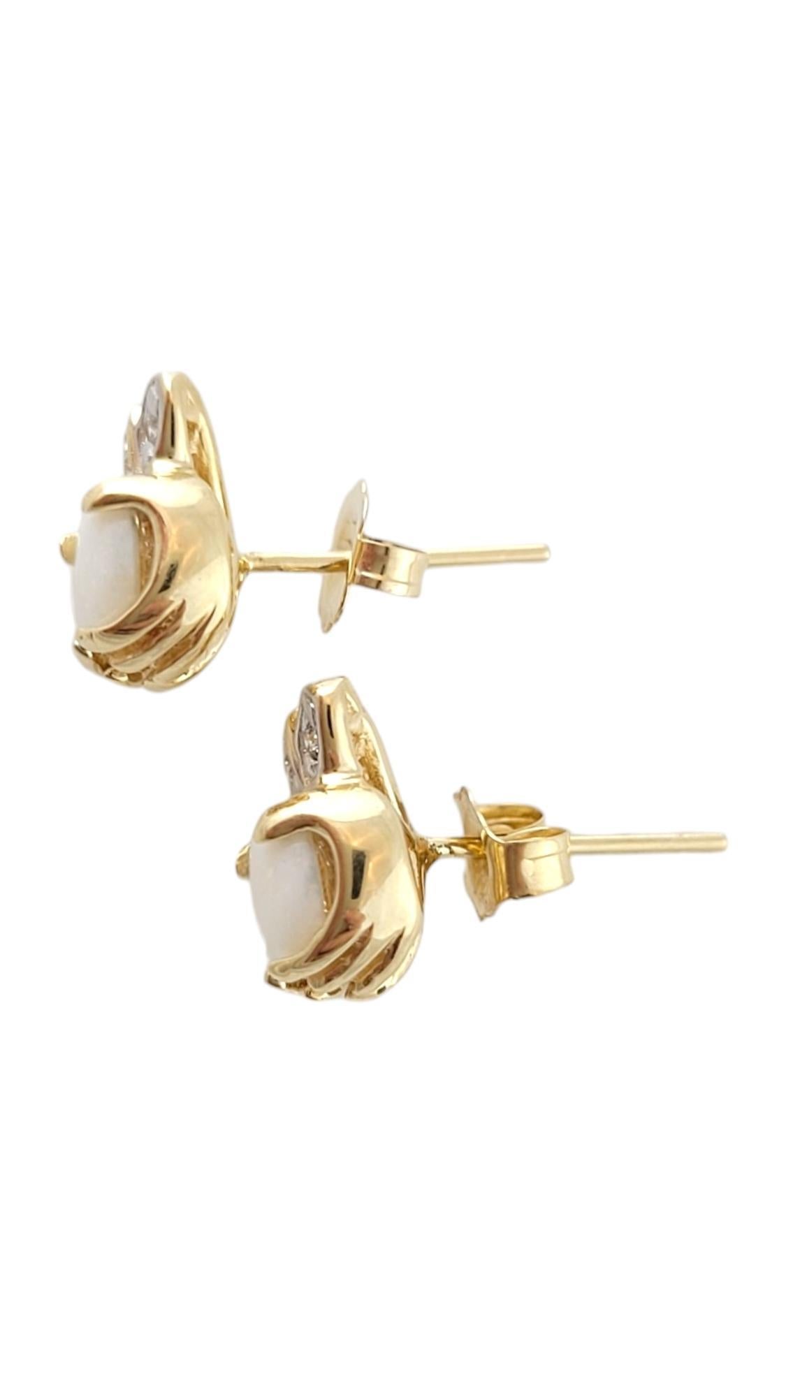 Vintage 14K yellow Gold Claddagh Opal and Diamond Stud Earrings

These beautiful earrings feature 2 gorgeous opal stones, and 4 round brilliant cut diamonds will sparkle on your ears!

Approximate total diamond weight: .04 cts

Diamond color: