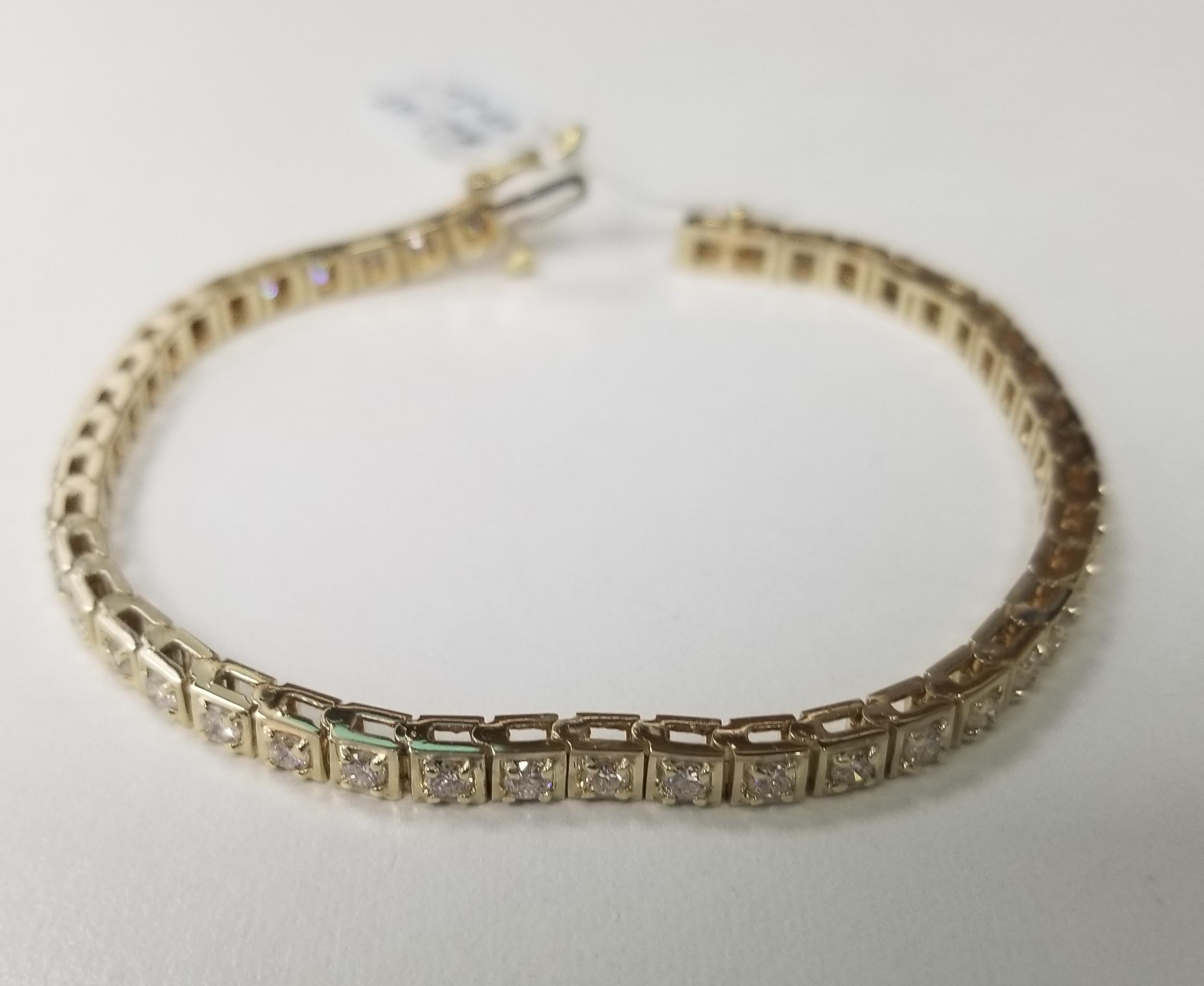 This is very beautiful 14k yellow gold classic box custom diamond tennis bracelet with 44 round diamonds color F-G and clarity VS2 weighing 2.55cts. very fine quality diamonds, bracelet measures 7 inches with clasp and safety.
Specifications:
main