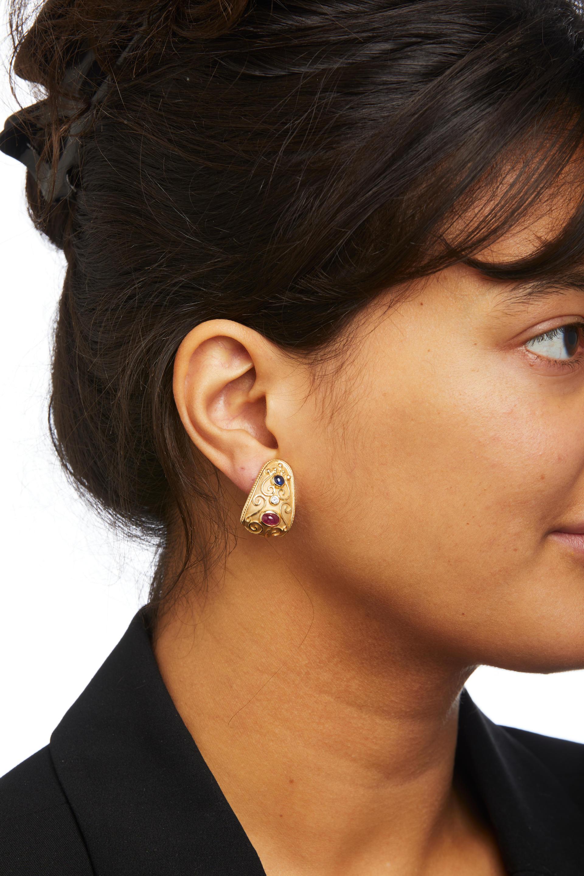 Beautiful Matte and High Polish 14k Yellow Gold Ruby, Diamond and Sapphire Clip On Earrings.
Weight of Diamonds 0.20tcw (0.10ct ea.), Ruby's are 6mm x 3.5mm and Sapphire's are 3.5 mm Wide (Approximate Weights and Measurements)
Gross weight 15.9