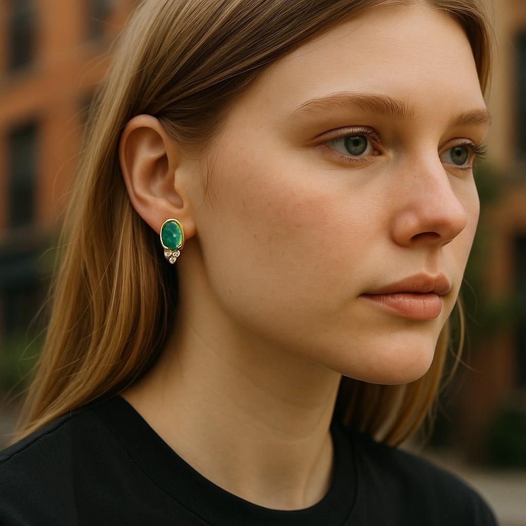 A Captivating Fusion of Luxury and Elegance
Elevate your jewelry collection with these exquisite 14K Yellow Gold Earrings, featuring a matched pair of Colombian cabochon emeralds and sparkling diamonds. Meticulously crafted, these earrings embody