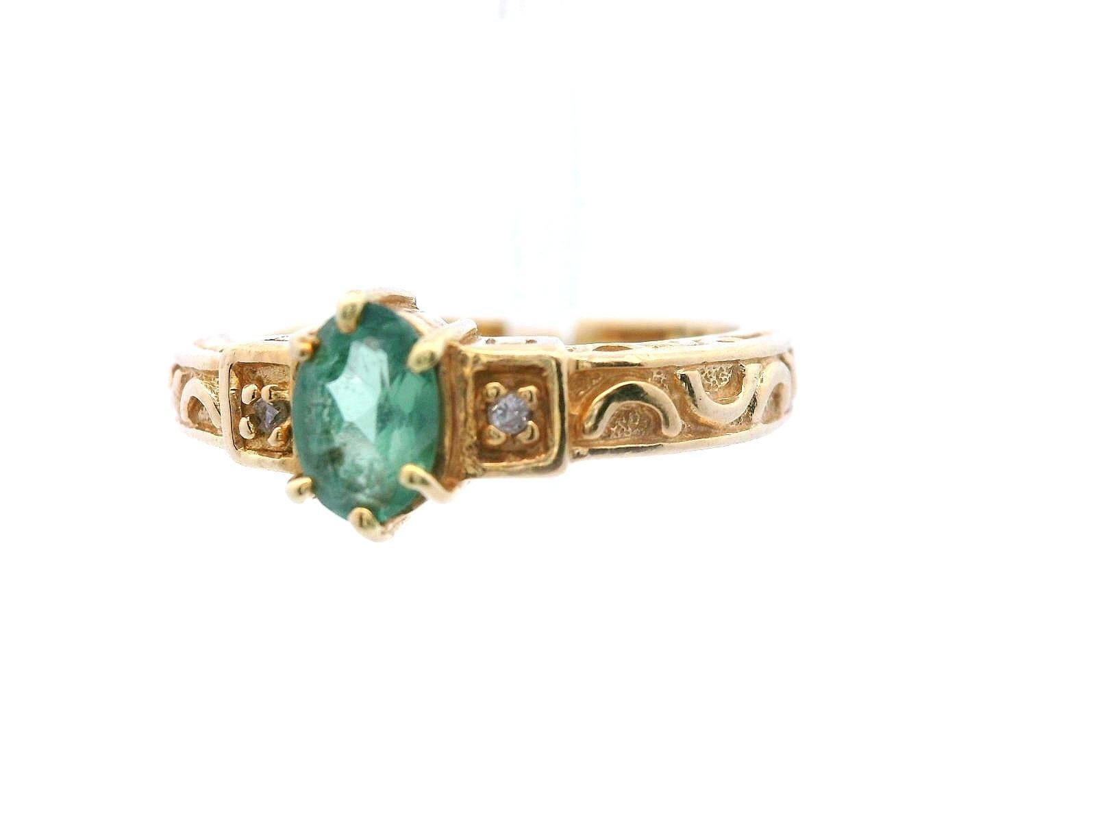 This gorgeous vintage ring is made in 14k yellow gold and features a color-change alexandrite and diamond. The oval cut, color-change, alexandrite is .45 carats and showcase a beautiful range of hues. On each side of the center stone is a round cut
