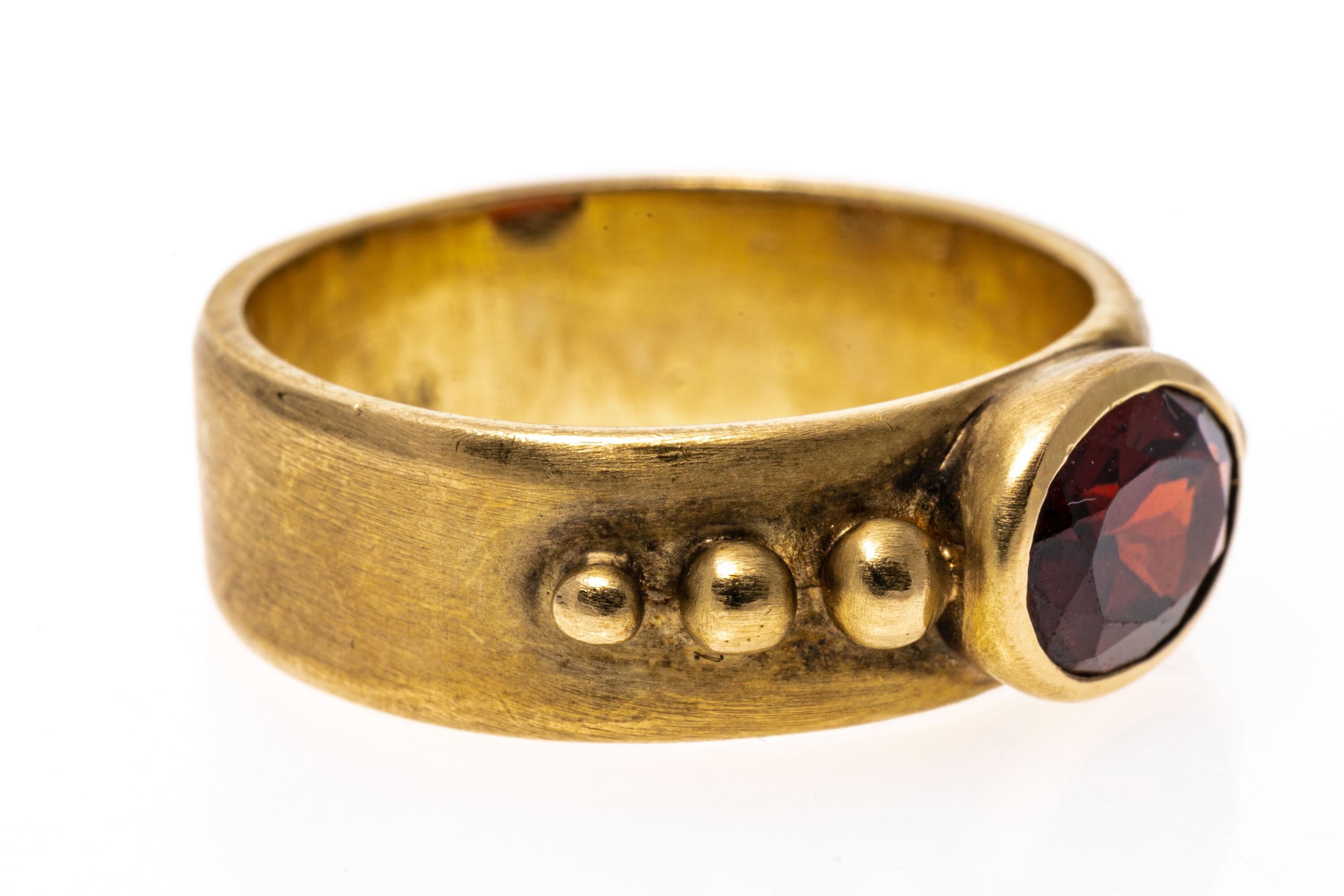 14k Yellow Gold Contemporary Burnished Bezel Set Garnet Band Ring In Good Condition For Sale In Southport, CT