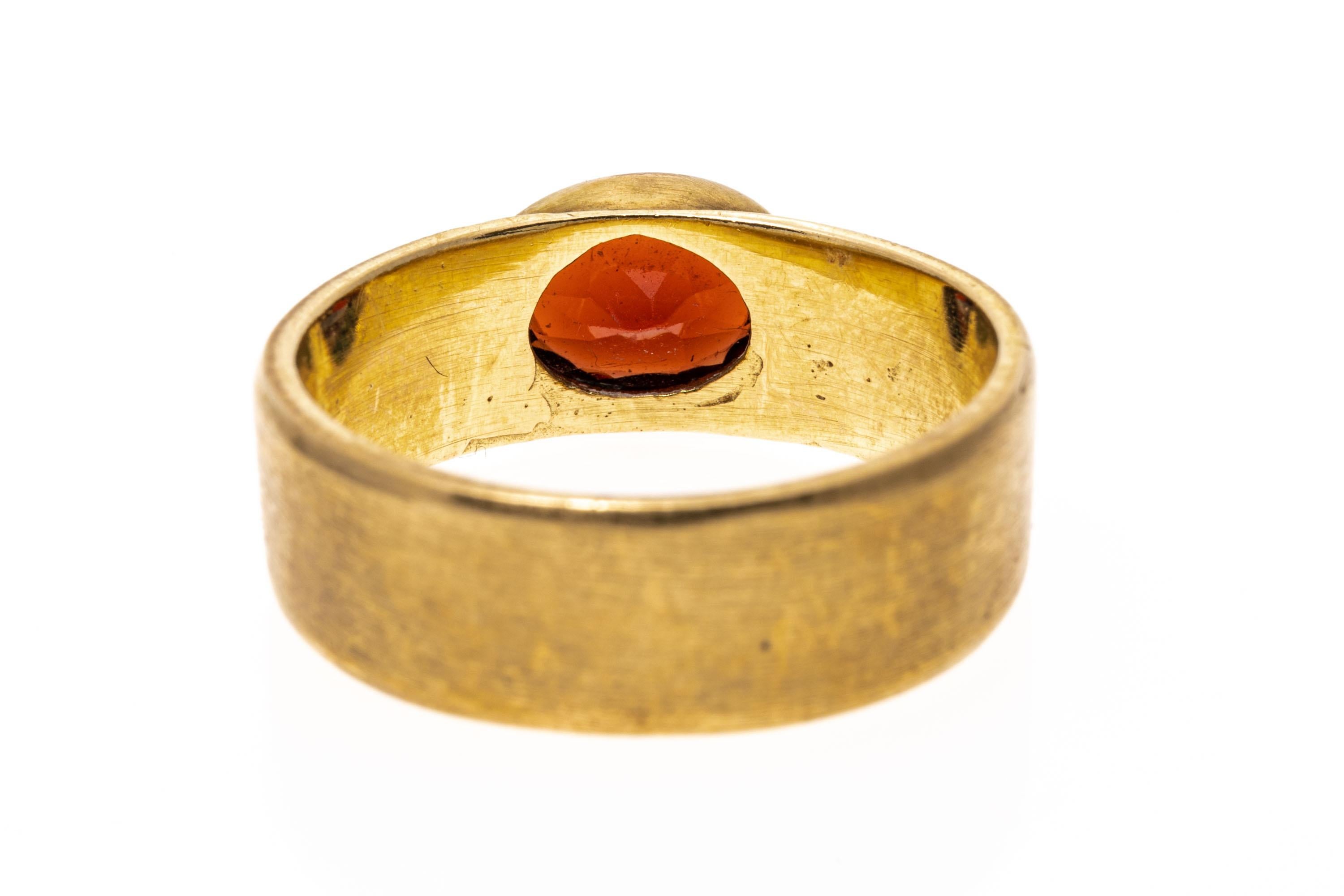 14k Yellow Gold Contemporary Burnished Bezel Set Garnet Band Ring For Sale 1