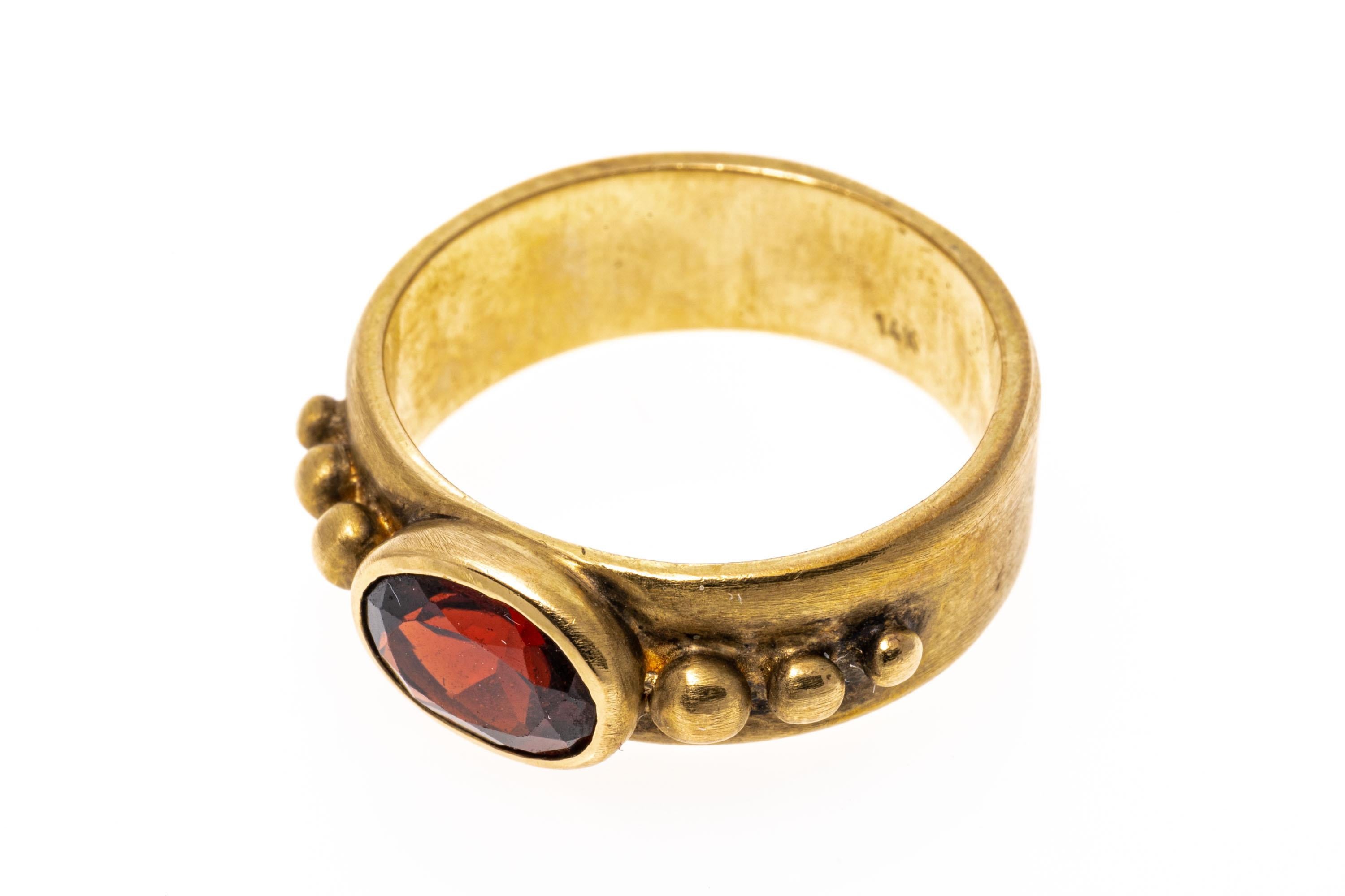 14k Yellow Gold Contemporary Burnished Bezel Set Garnet Band Ring For Sale 2