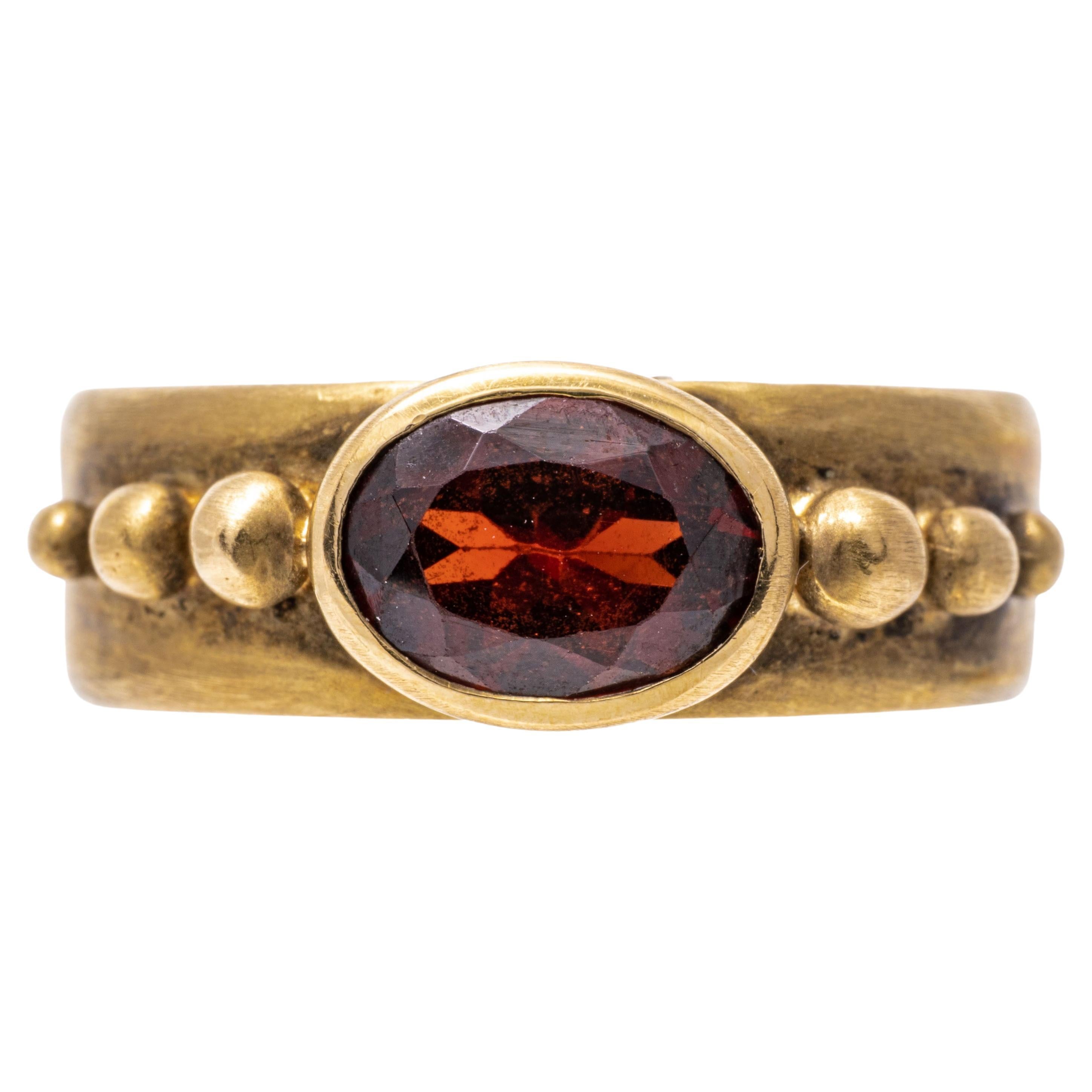 14k Yellow Gold Contemporary Burnished Bezel Set Garnet Band Ring For Sale