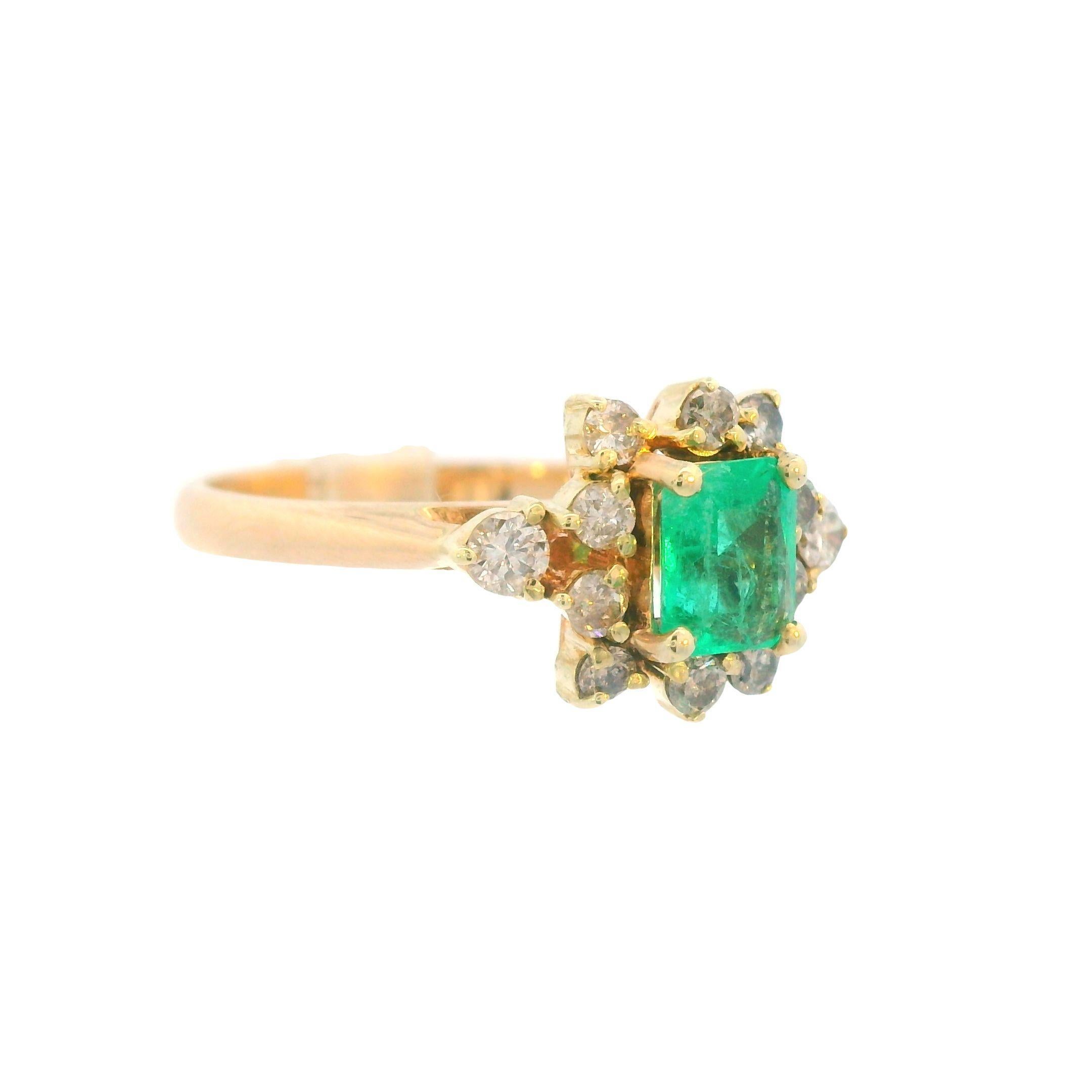 This lovely contemporary halo ring is made in 14k yellow gold and contains vivid green emerald, as well as bright, beautiful diamonds. The 14k yellow gold and 12 sparkely white diamonds complement the .53 carat emerald center stone exceptionally by