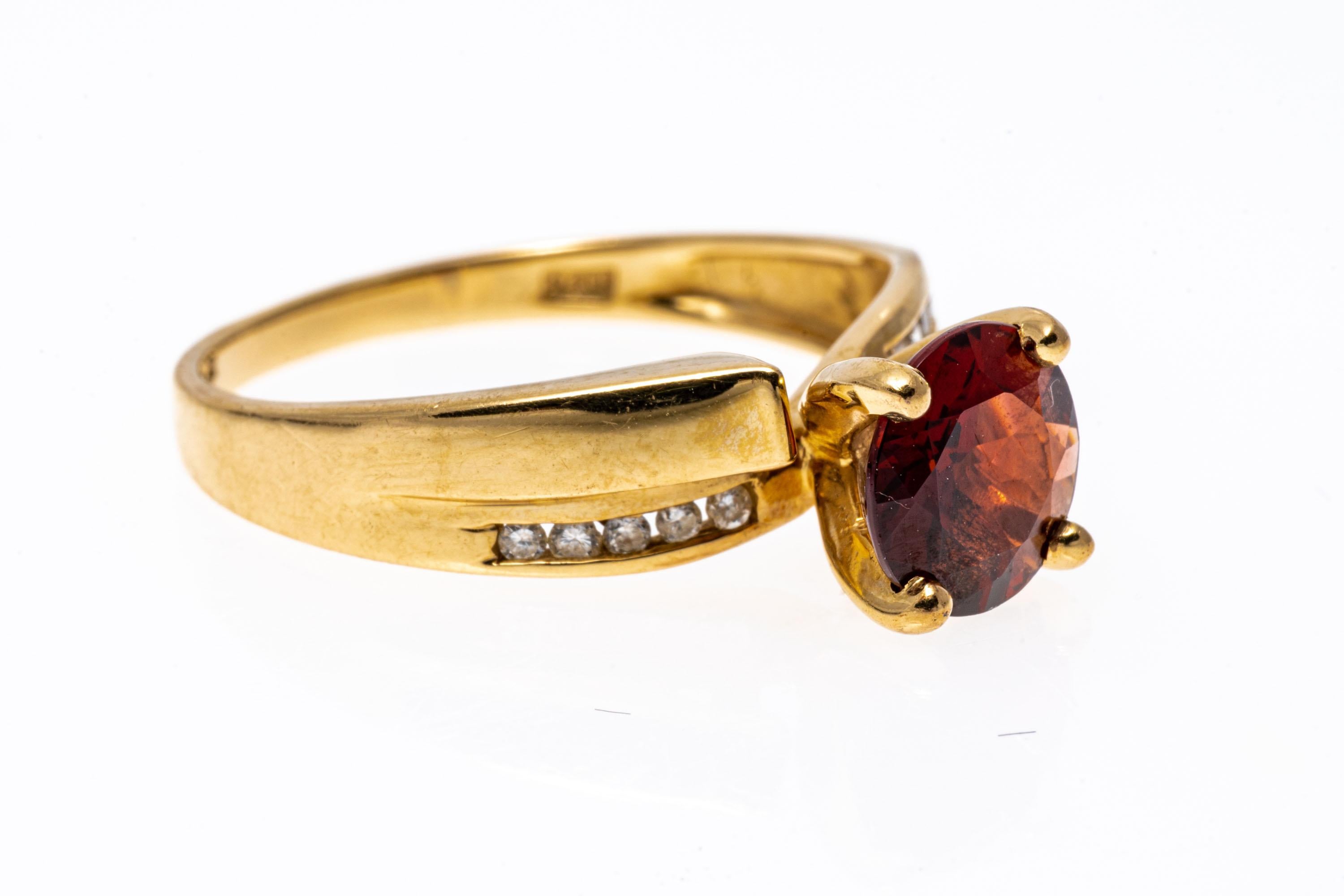 Round Cut 14k Yellow Gold Contemporary Garnet and Channel Diamond Ring For Sale