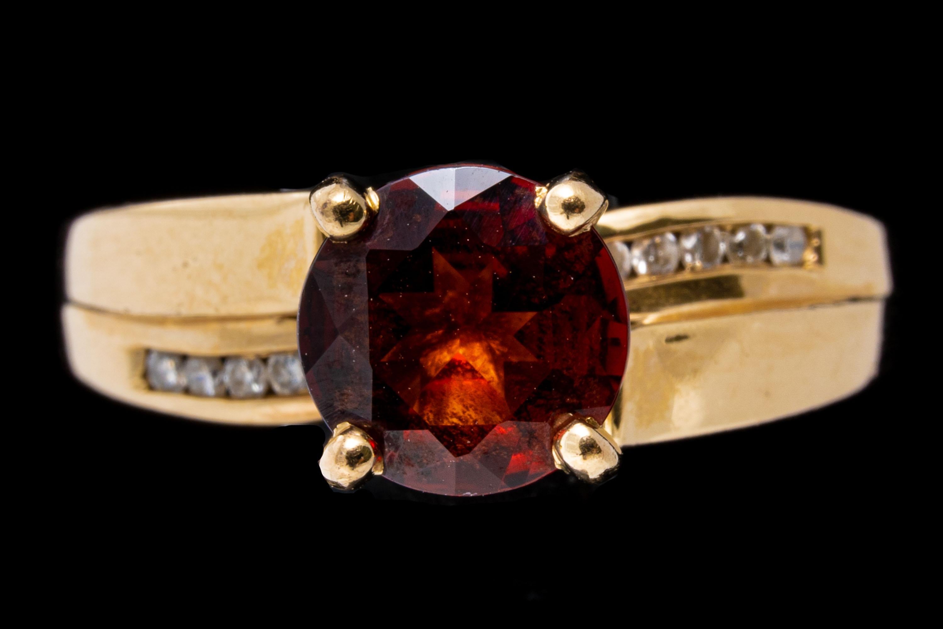 Women's 14k Yellow Gold Contemporary Garnet and Channel Diamond Ring For Sale