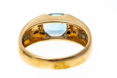 14k Yellow Gold Contemporary Horizontal Oval Blue Topaz Ring