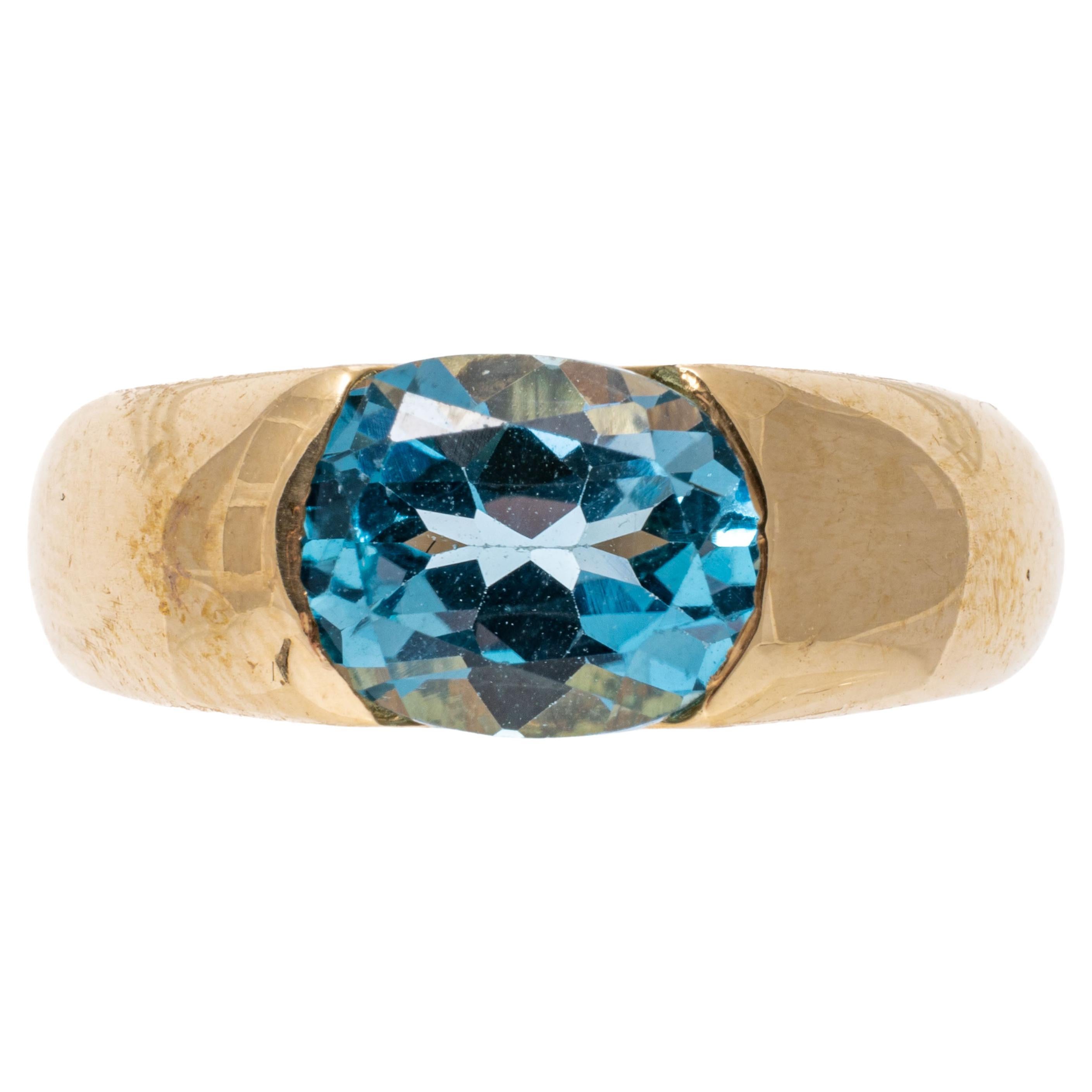 14k Yellow Gold Contemporary Horizontal Oval Blue Topaz Ring