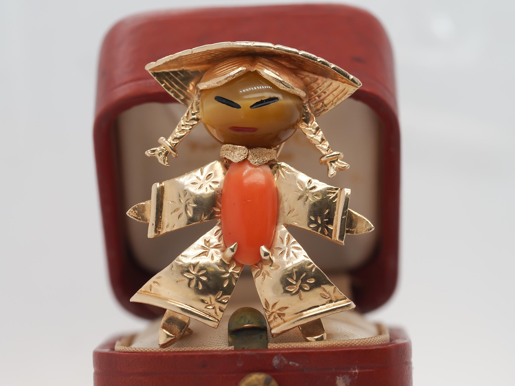 Item Details:
Metal Type: 14K Yellow Gold   [Hallmarked, and Tested]
Weight: 10.90  grams

Stones: Coral and Tigers Eye.

Pin Measurements:
Diameter: 1.5 inches
Condition:  Excellent