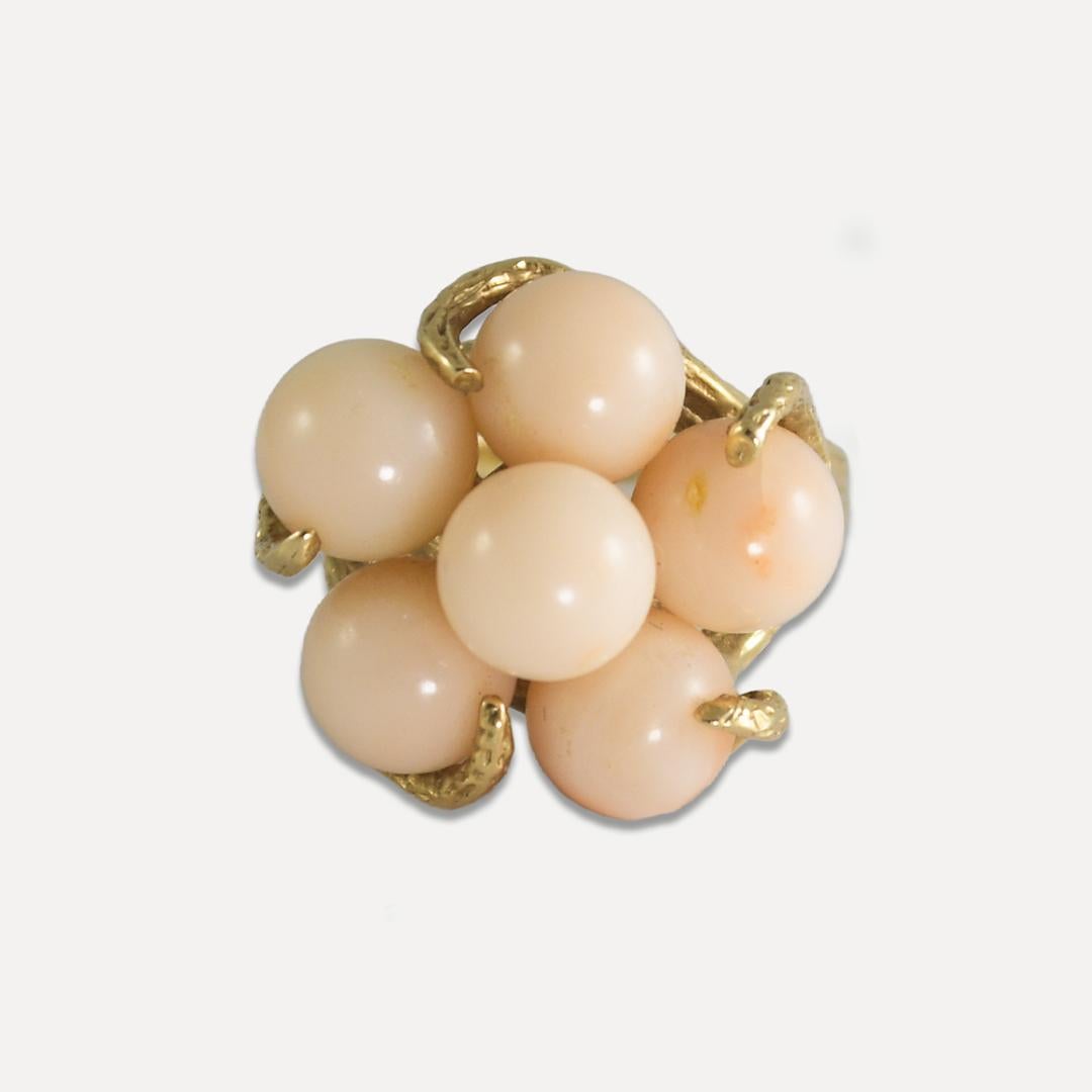 Coral earrings and ring set.
Stamped 14k.
The gross weight is 22 grams, net gold is 11.5 grams.
The coral is natural and is a whitish to light pink color.
The ring has a bark finish on the side and is a size 7. 
It can be sized to fit.
There is one