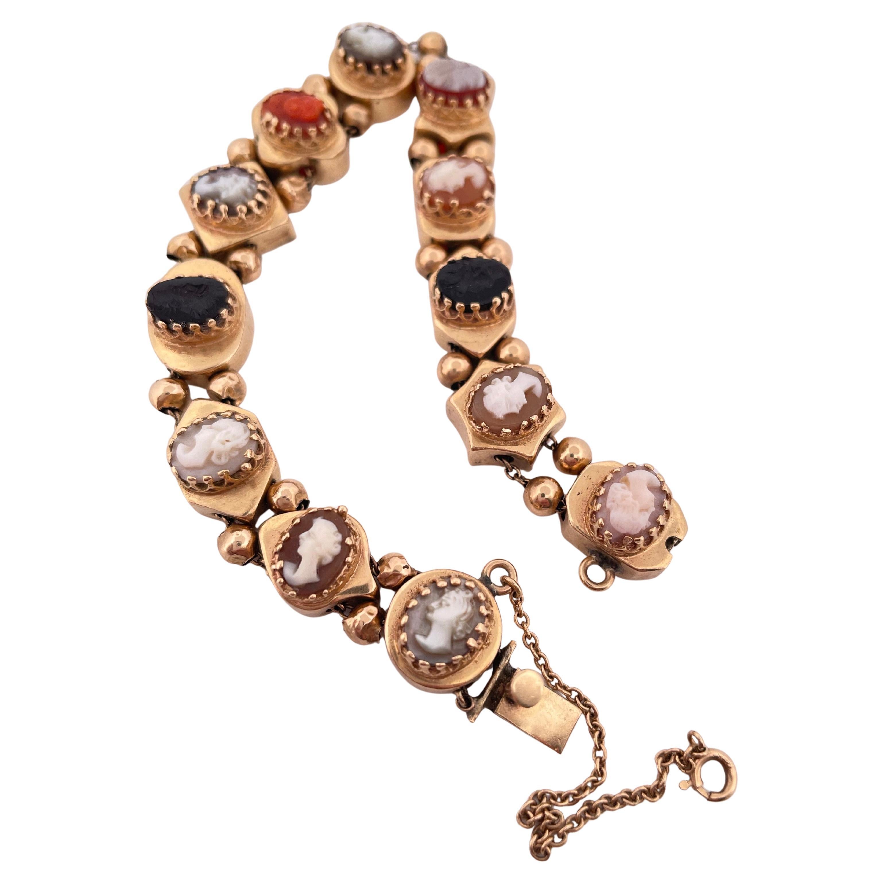 Art Deco 14k Yellow Gold Coral, Onyx, And Shell Slide Cameo Bracelet For Sale