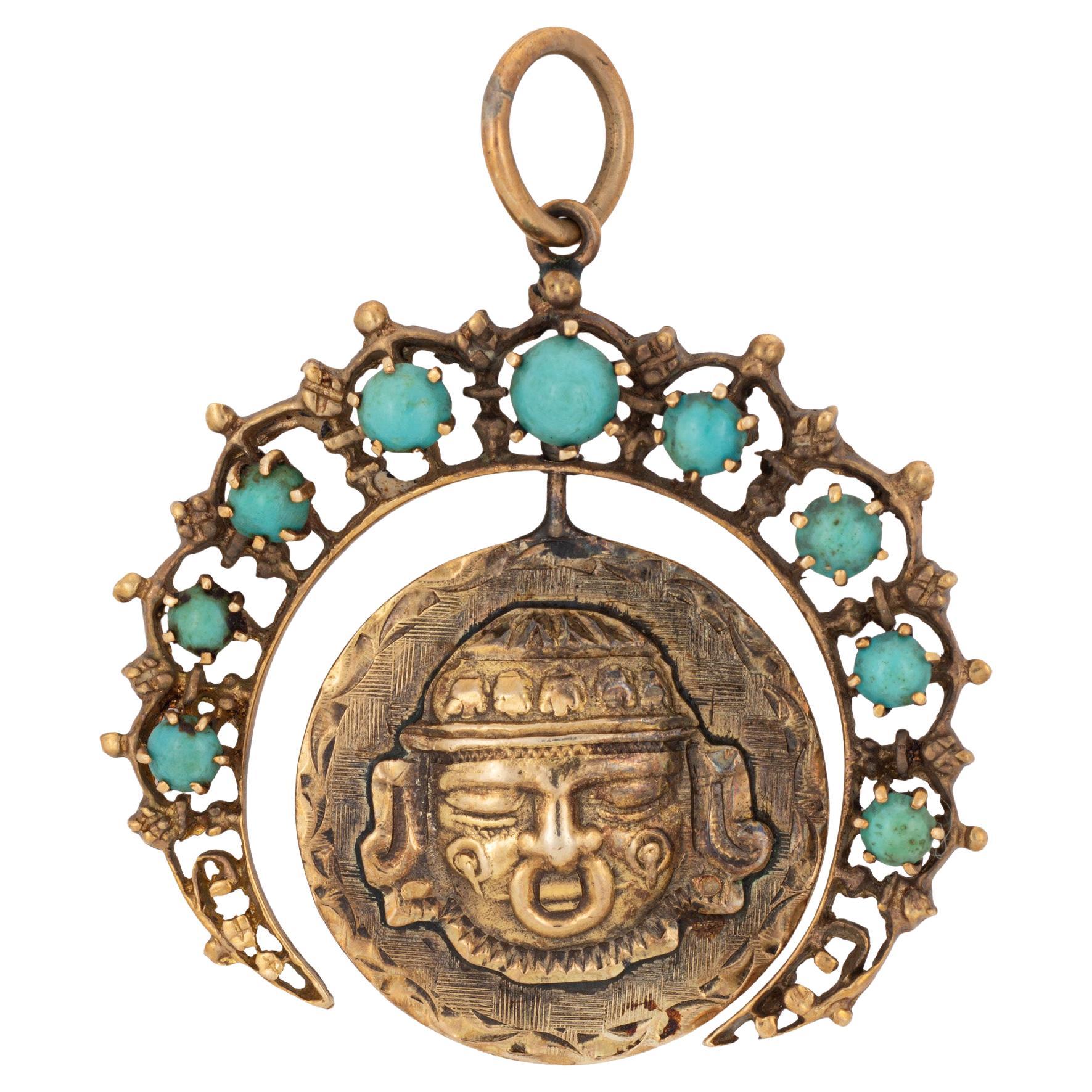 14k yellow gold (crescent moon) and 18k yellow gold (center medallion pendant).
