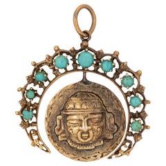 14k yellow gold (crescent moon) and 18k yellow gold (center medallion pendant).