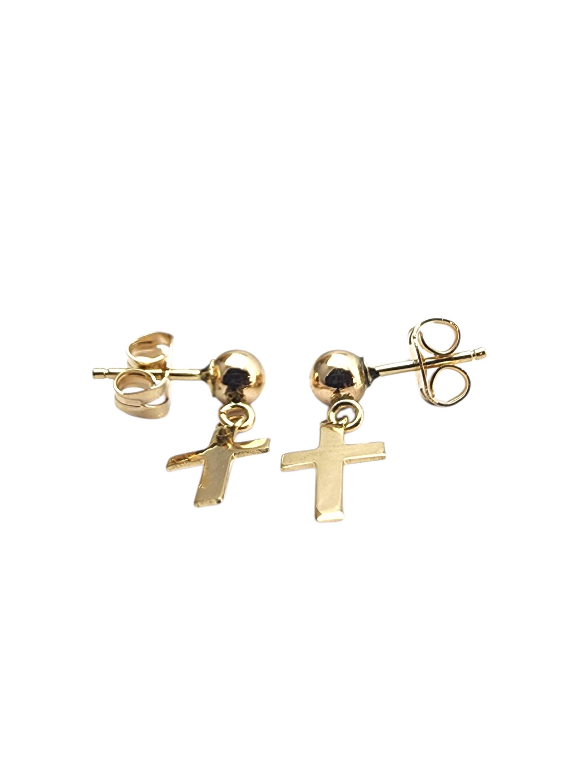 14K Yellow Gold Dangle Cross Earrings-

These 14K Yellow Gold Dangle Cross Earrings offer a graceful blend of faith and elegance, perfect for everyday wear or special occasions.

Size: 16.1 mm x 6.3 mm

Stem: 8.2 mm

Weight: 0.8 gr./ 0.5 dwt.

Very
