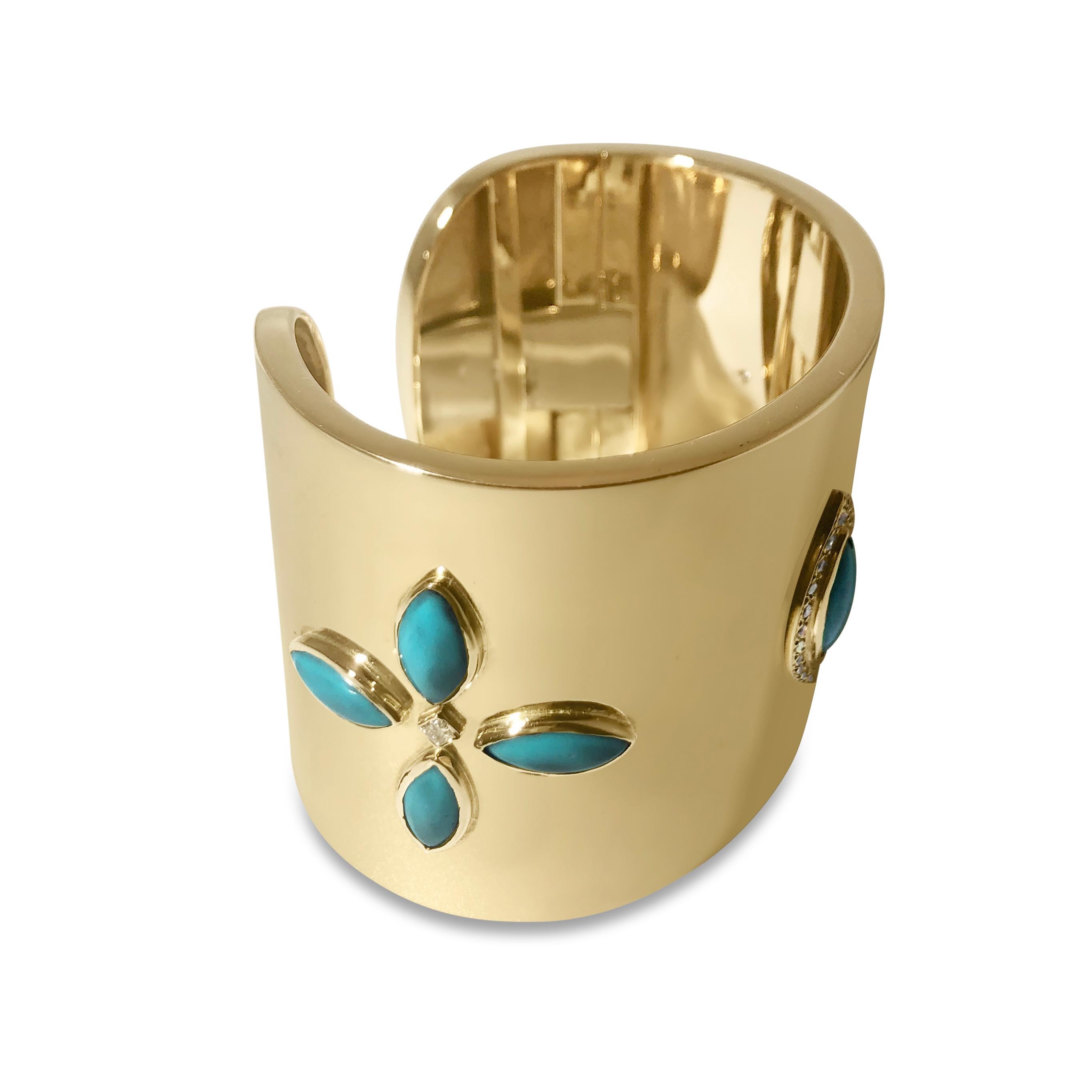 Our statement cuff will wow you and everyone else who sees it! This 2 inch back-hinged cuff bracelet features high shine 14K yellow gold with 24 round 1.6mm and 2.4mm white diamonds, totaling 0.60ct, and 9 polished turquoise