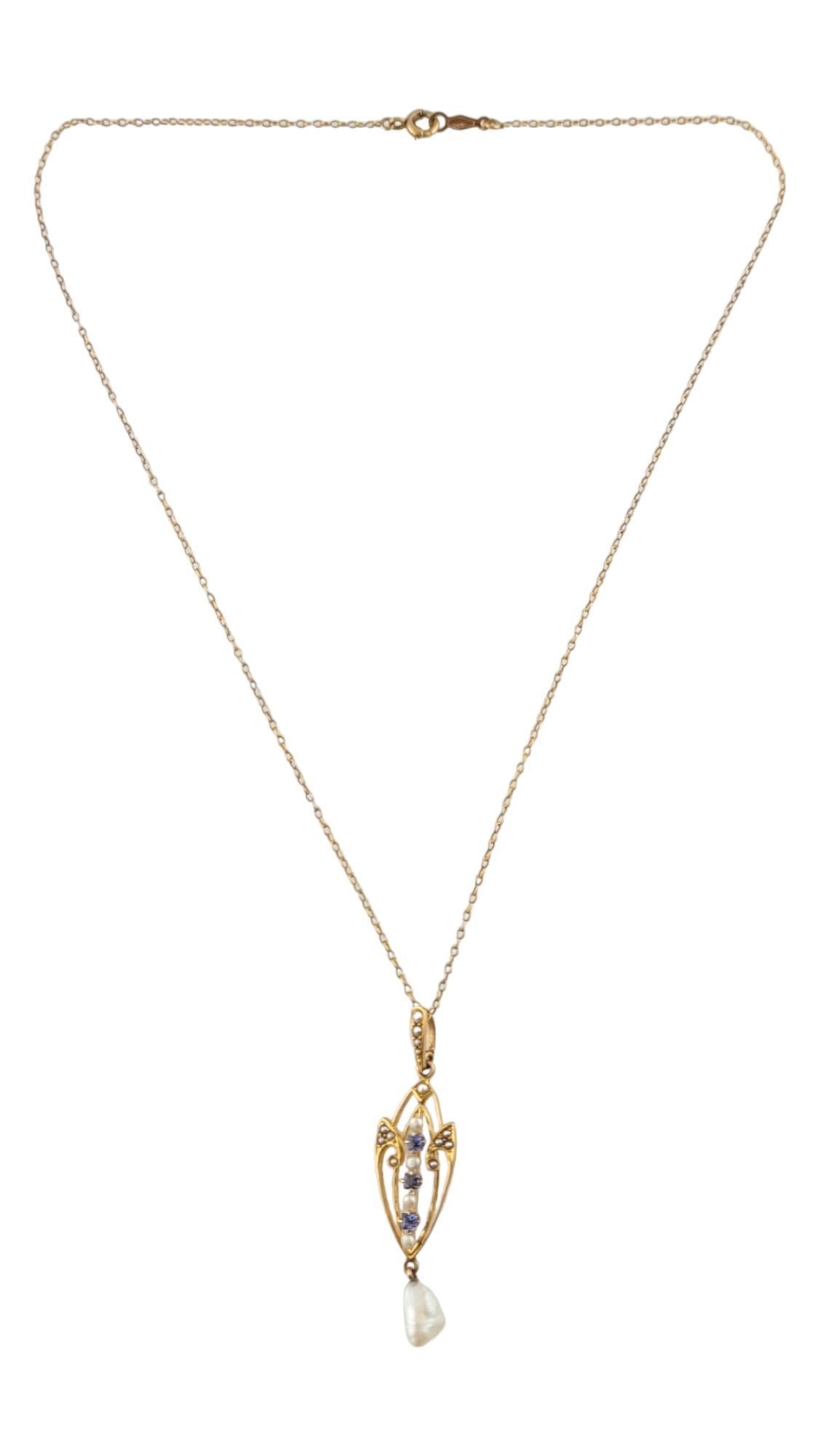 14K Yellow Gold Cultured Seed & Baroque Pearls with Blue Lab Created Spinels Necklace

This gorgeous 14K yellow gold chain necklace is paired with a beautiful 14K gold pendant decorated with 18 cultured seed and baroque pearls as well as three lab