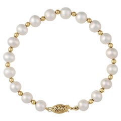 Bracciale in oro giallo 14K con perle d'acqua dolce bianche coltivate da 7 1/4".
