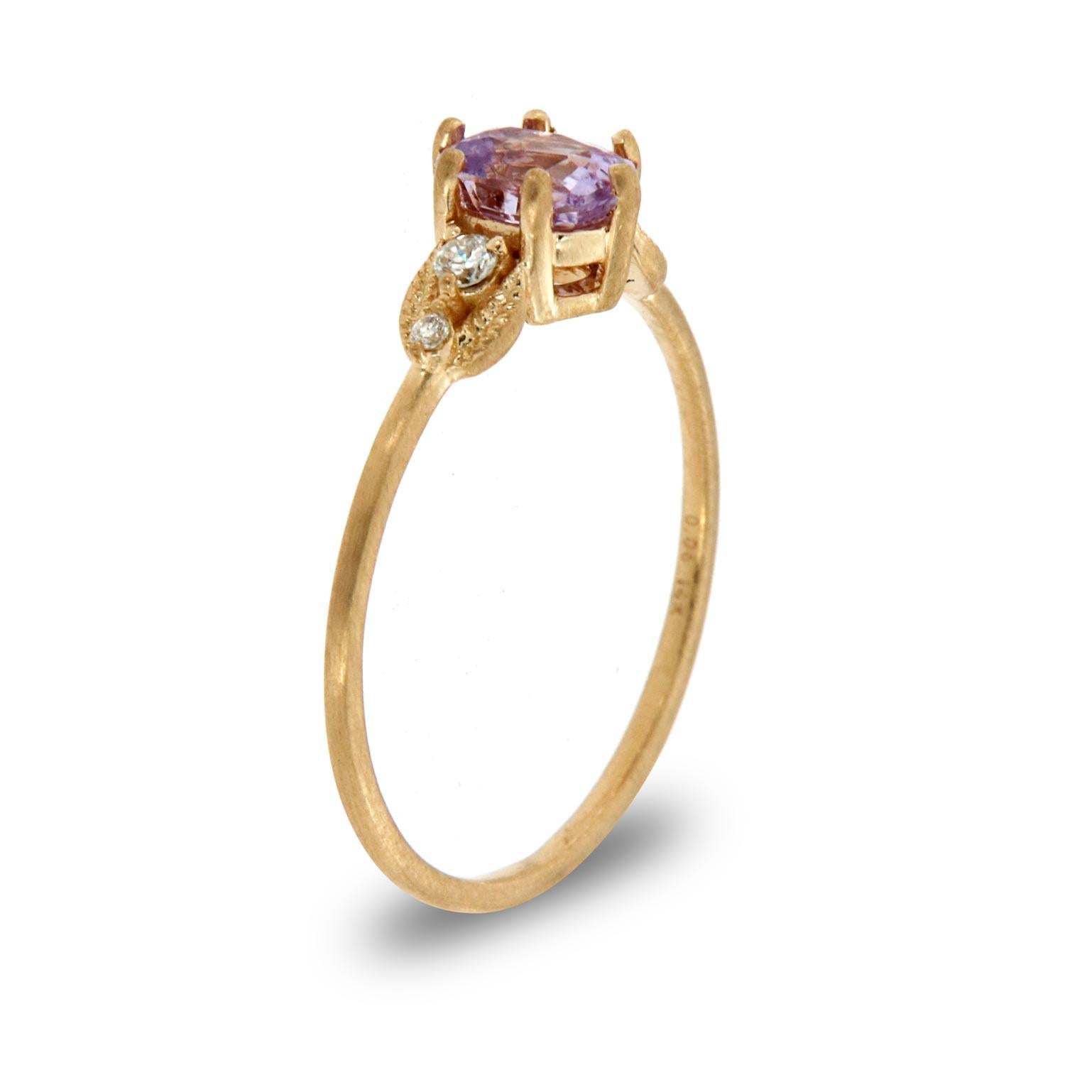 This petite organic style rustic ring is impressive in its vintage appeal, featuring a natural lavender oval sapphire, accented with round brilliant diamonds encircled by a delicate milgrain design. Experience the difference in person!

Product
