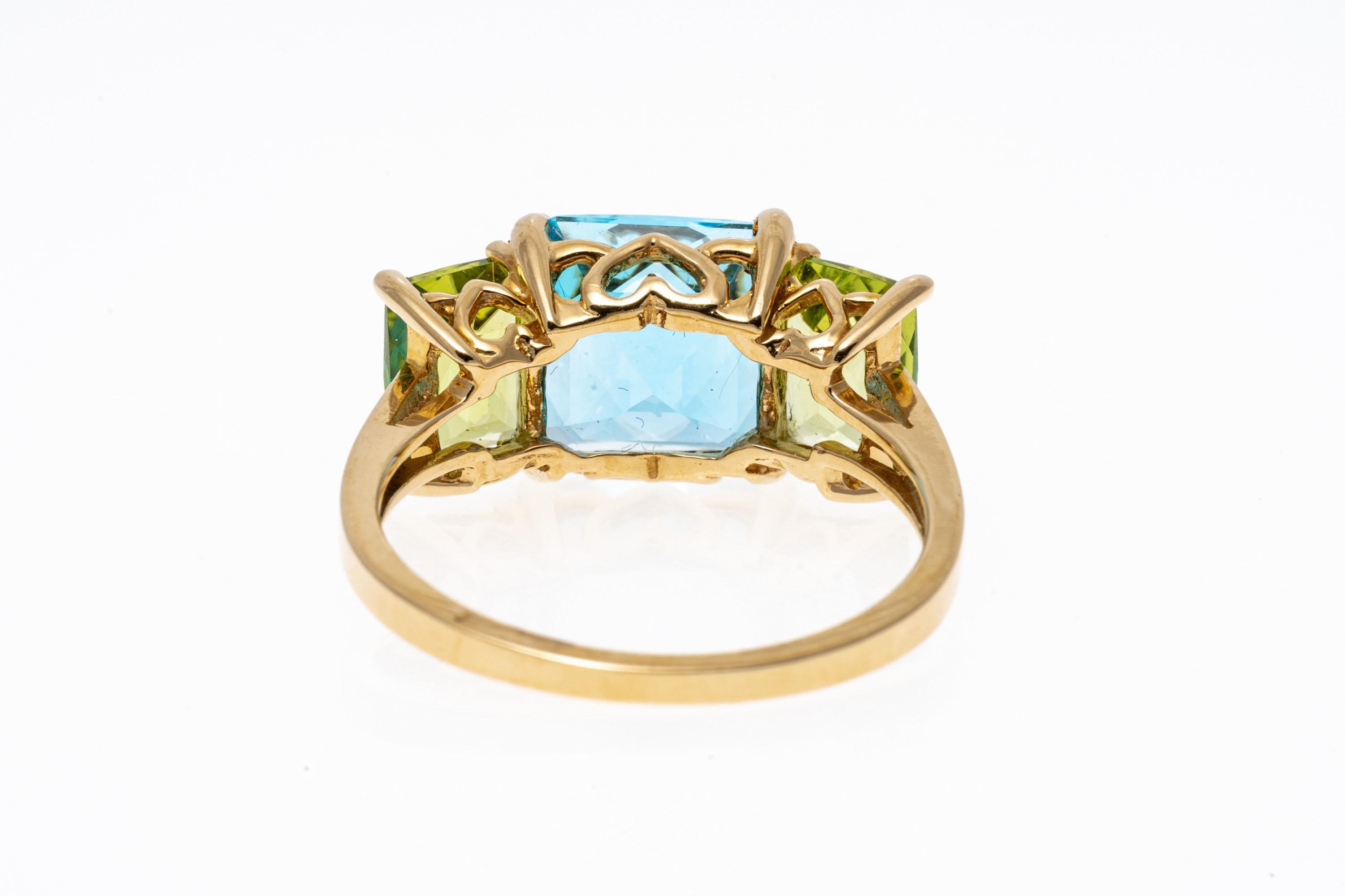 14k Yellow Gold Cushion Three Stone Swiss Blue Topaz and Peridot Ring For Sale 2
