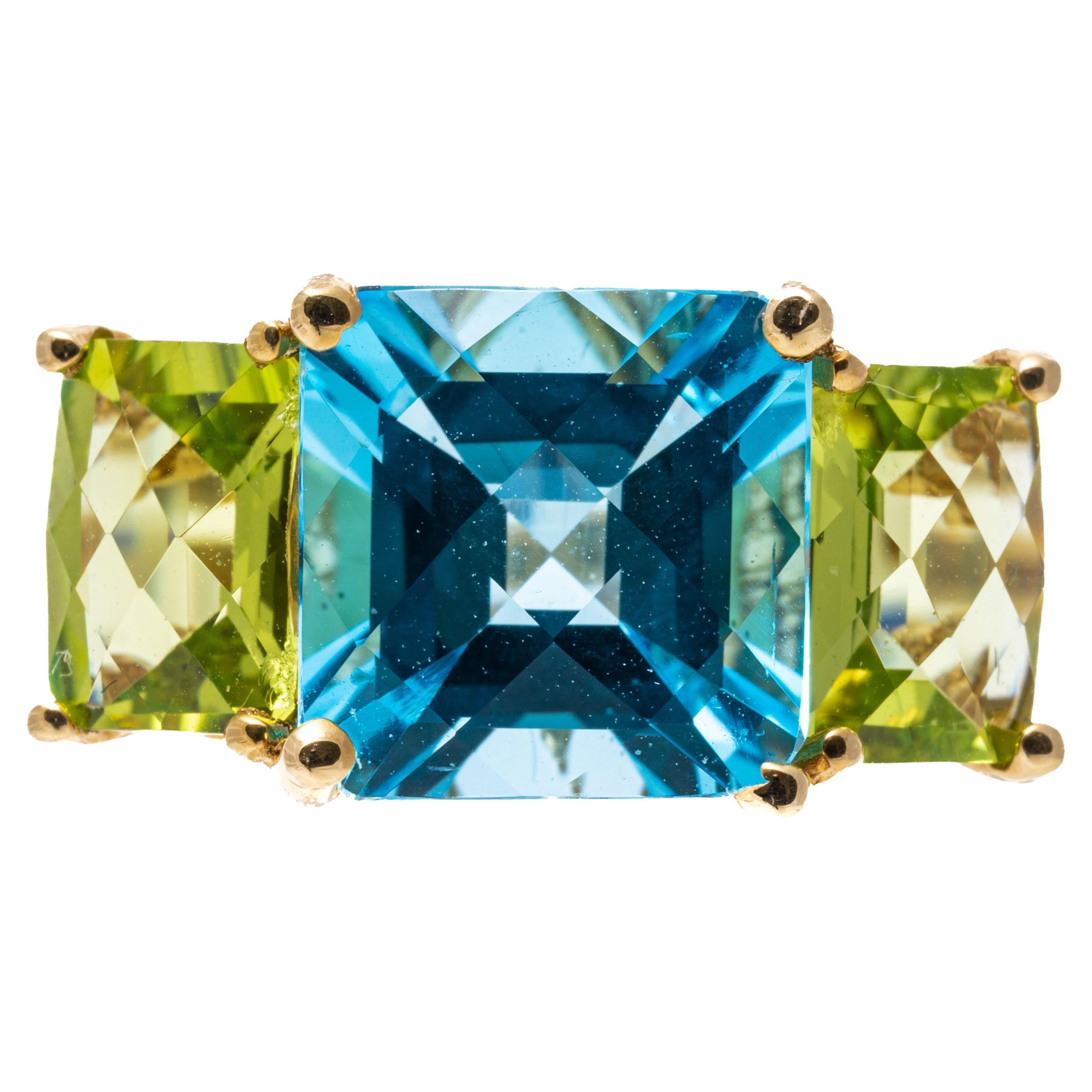 14k Yellow Gold Cushion Three Stone Swiss Blue Topaz and Peridot Ring For Sale