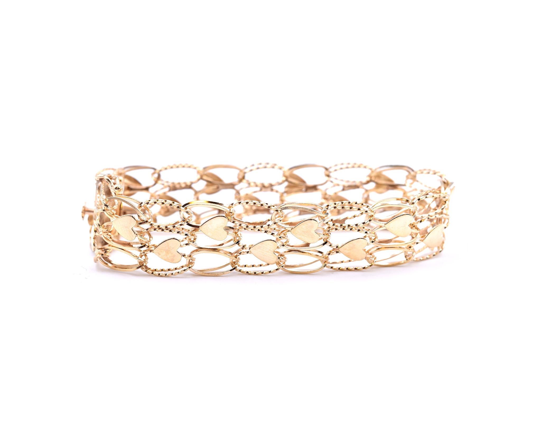 Designer: custom design
Material: 14k yellow gold
Dimensions: bracelet is 7-inches long and 15.70mm wide
Weight: 17.8 grams
