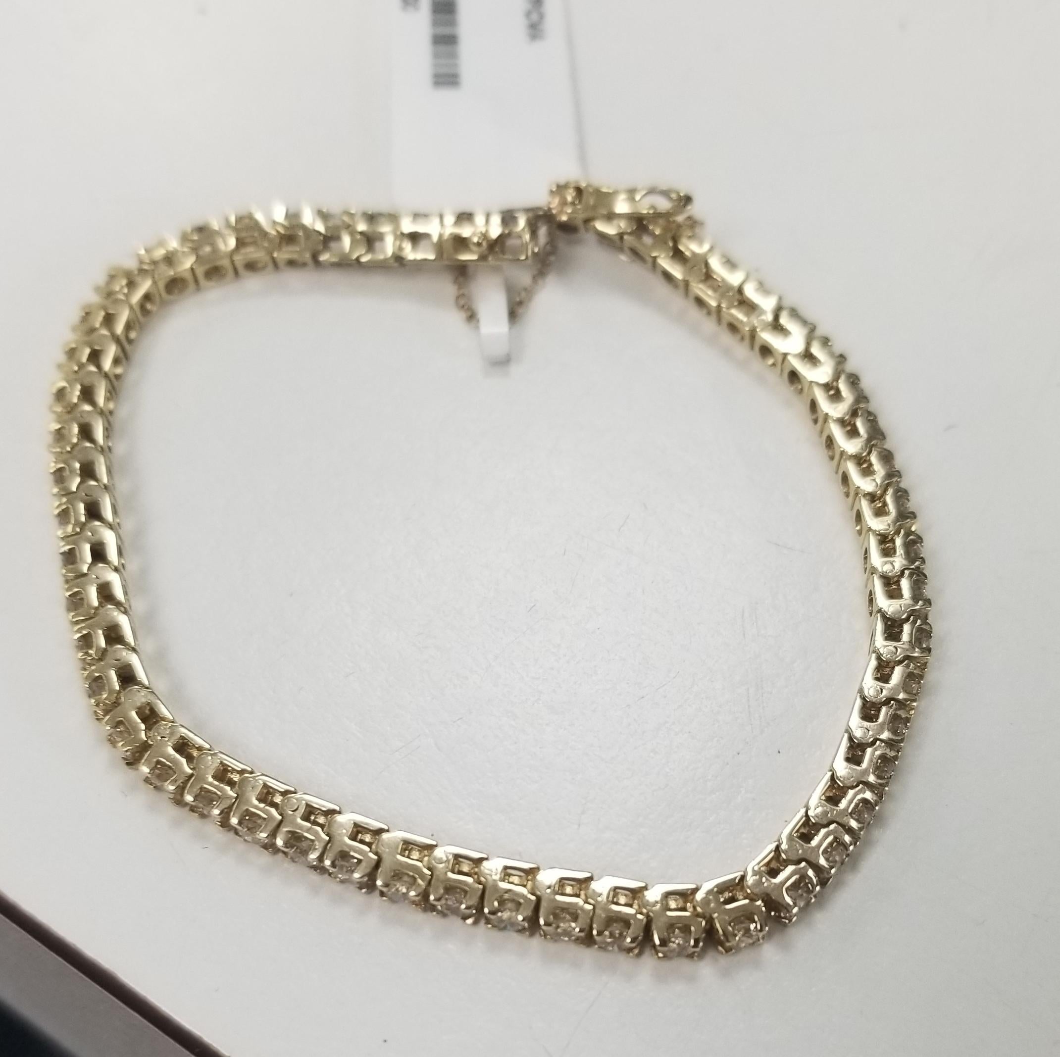 This is very beautiful 14k yellow gold custom made tennis bracelet with 54 round diamonds color G-H and clarity SI1 weighing 3.24cts.
Specifications:
    main stone: ROUND DIAMONDS
    diamonds: 54 PCS
    carat total weight: 3.24
    color: G-H
*We