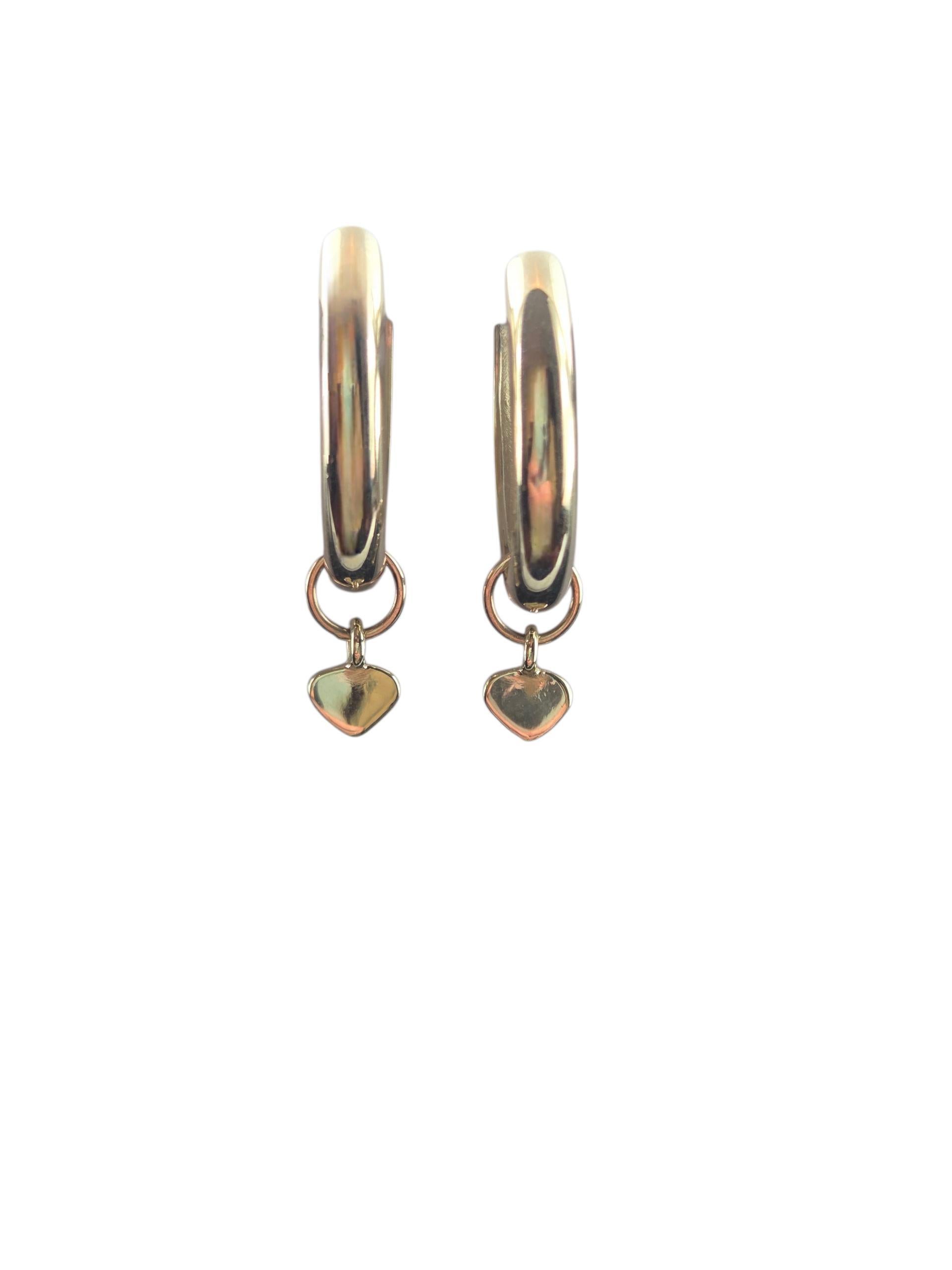 Orecchini a cerchio ovali con cuore pendente in oro giallo 14k #23138