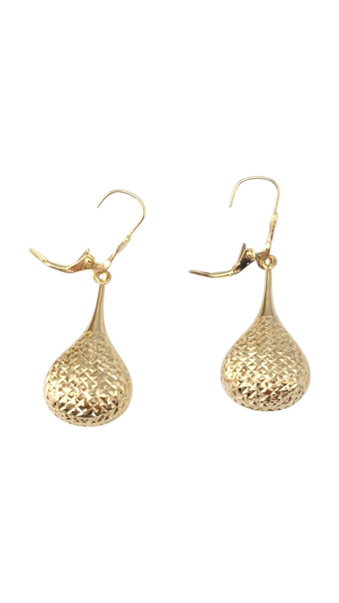 14K Yellow Gold Dangle Teardrop Earrings -

These dangle earrings feature an elegant, flowing design that adds movement and sophistication to any look. Whether simple or detailed, their graceful drop style makes them perfect for both everyday wear