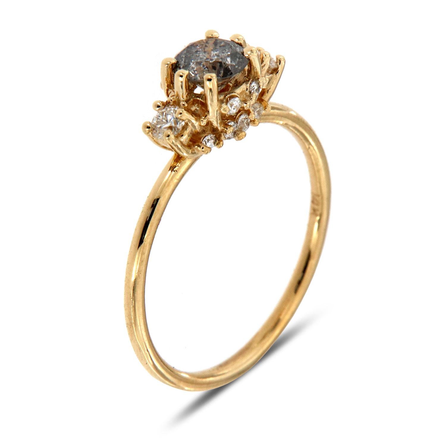 This petite ring is from our Vale collection is impressive in its Earthy & Organic appeal. It features a 0.46 -carat Salt and Pepper round diamond set in six tiny prongs and flanked by two perfectly Round-Sha[aped diamonds. Eight (8) round diamonds