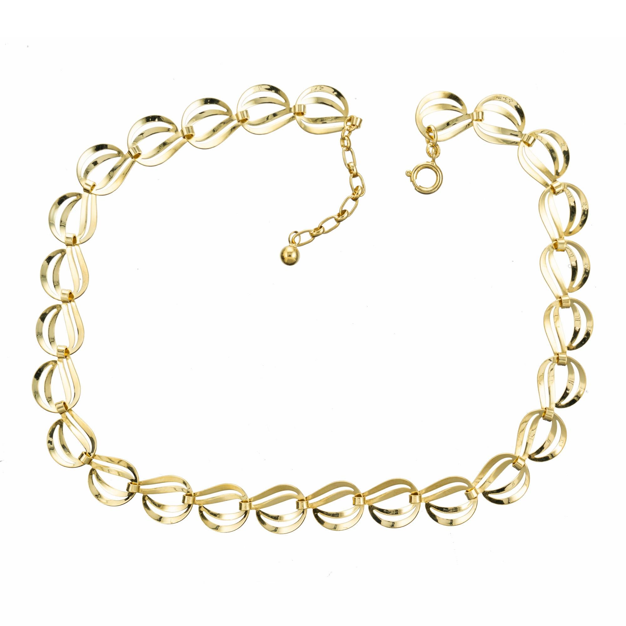 Nice open swirl design link necklace. This piece measures 15.5 Inches with an extension that makes it wearable to 17.25 Inches. Designer style swirl link necklace exudes elegance and sophistication. This exquisite piece features a double link design