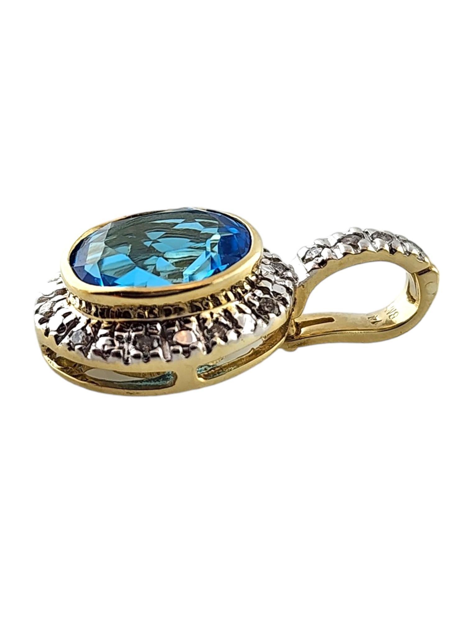 14K Yellow Gold Diamond and Blue Topaz Pendant 

This beautiful pendant features a stunning blue topaz stone in the center of 14 sparkling round brilliant cut diamonds all set in 14K yellow gold!

Approximate total diamond weight: .10 cts

Diamond