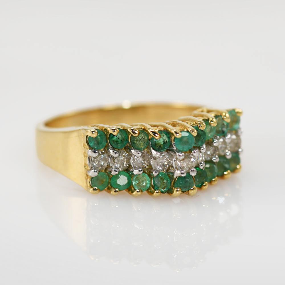 14k yellow gold diamond and emerald ring. 
There is 1.00tcw, Diamonds are I1 clarity, G-H-I color.
Natural Emeralds, light green color
Stamped 14k, weighs 5.1gr
size 8, can be sized for additional fee.