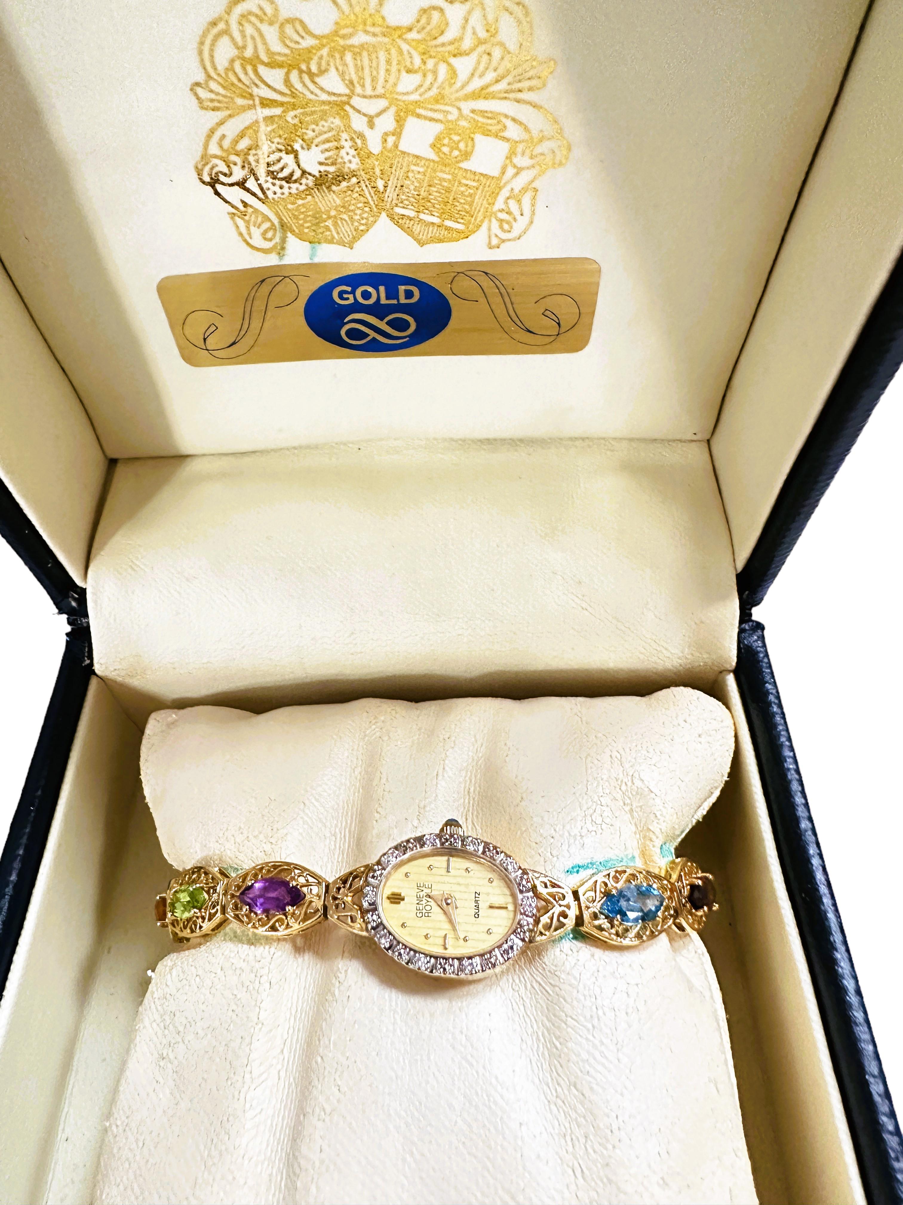 This is a really beautiful watch!  The case as well as the bracelet are 14k Gold.  The bracelet is a gorgeous filigree pattern and has 12 marquise cut gemstones measuring 8 x 4 mm.  The gemstones are citrine, amethyst, peridot, garnet and topaz.  It