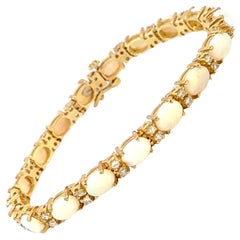 Bracelet tennis en or jaune 14 carats, diamants et opales
