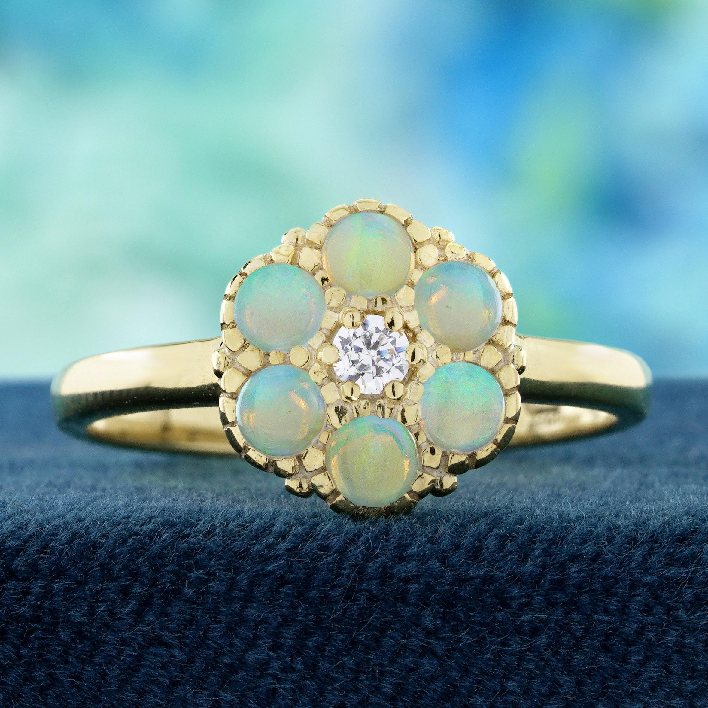 A brilliant diamond sparkles at the heart of this vintage-style cluster ring, shining like a drop of morning light. Soft, iridescent opals encircle it in a floral-inspired arrangement, creating the look of delicate petals glowing with shifting