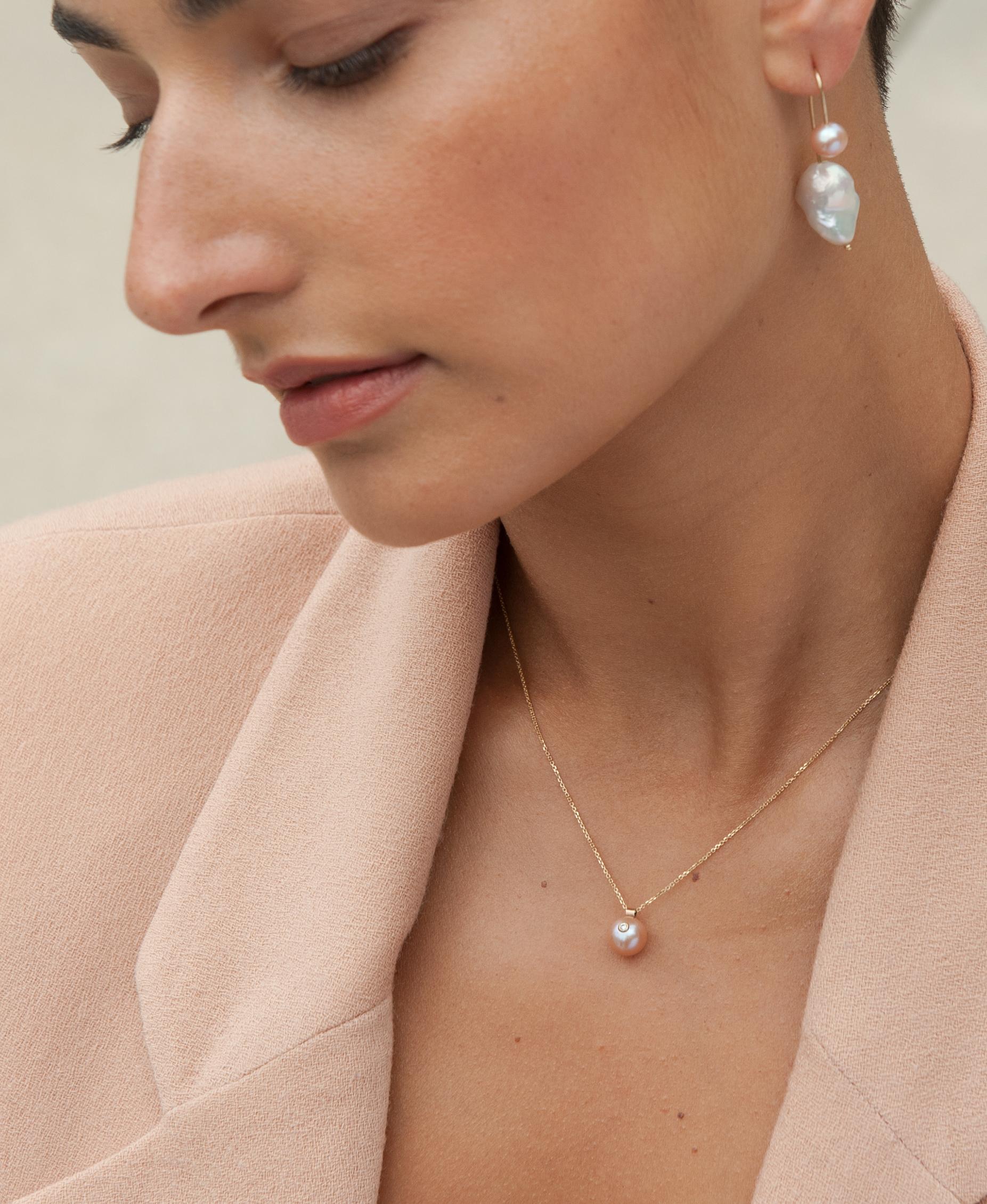 Elegant, feminine, unexpected.  This customizable pearl and diamond necklace (we call it The Everly) feels luxurious, while being delicate and timeless.  Wear it against bare skin or over a lightweight turtleneck for cooler temperatures. Great for